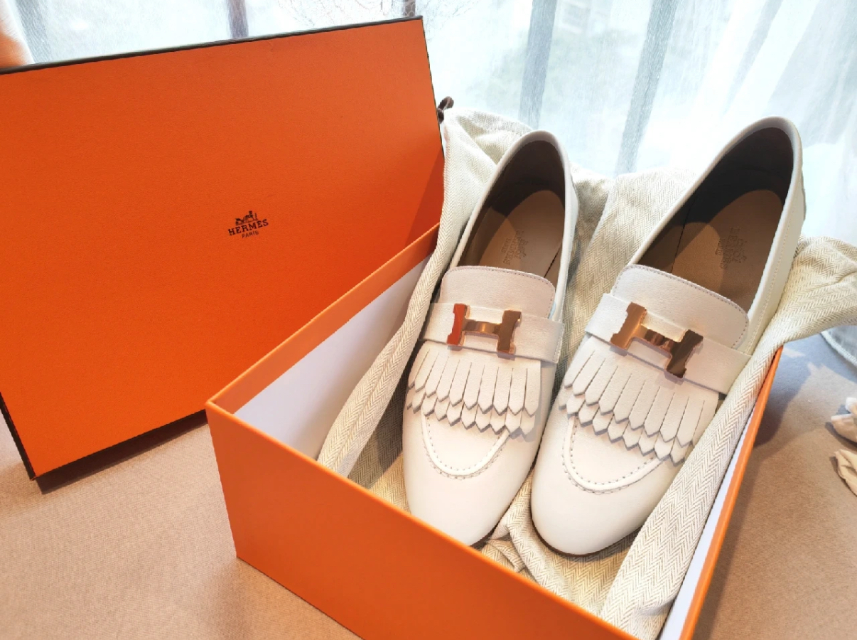 Hermès women's loafers with gold and silver buckles