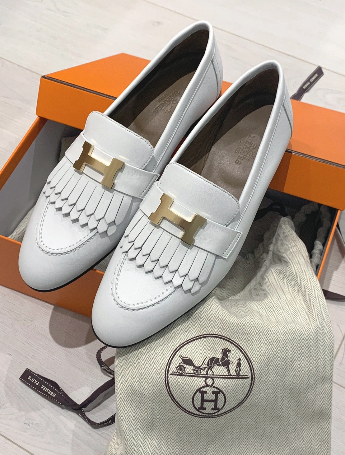 Hermès women's loafers with gold and silver buckles