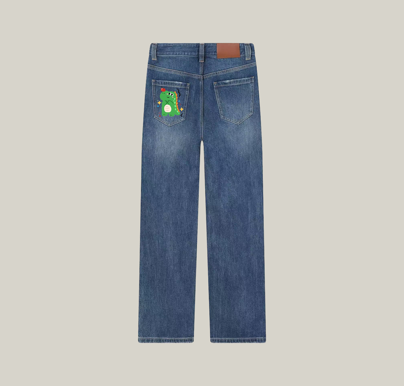 A pair of jeans featuring a little dinosaur print—an essential item for your summer wardrobe.