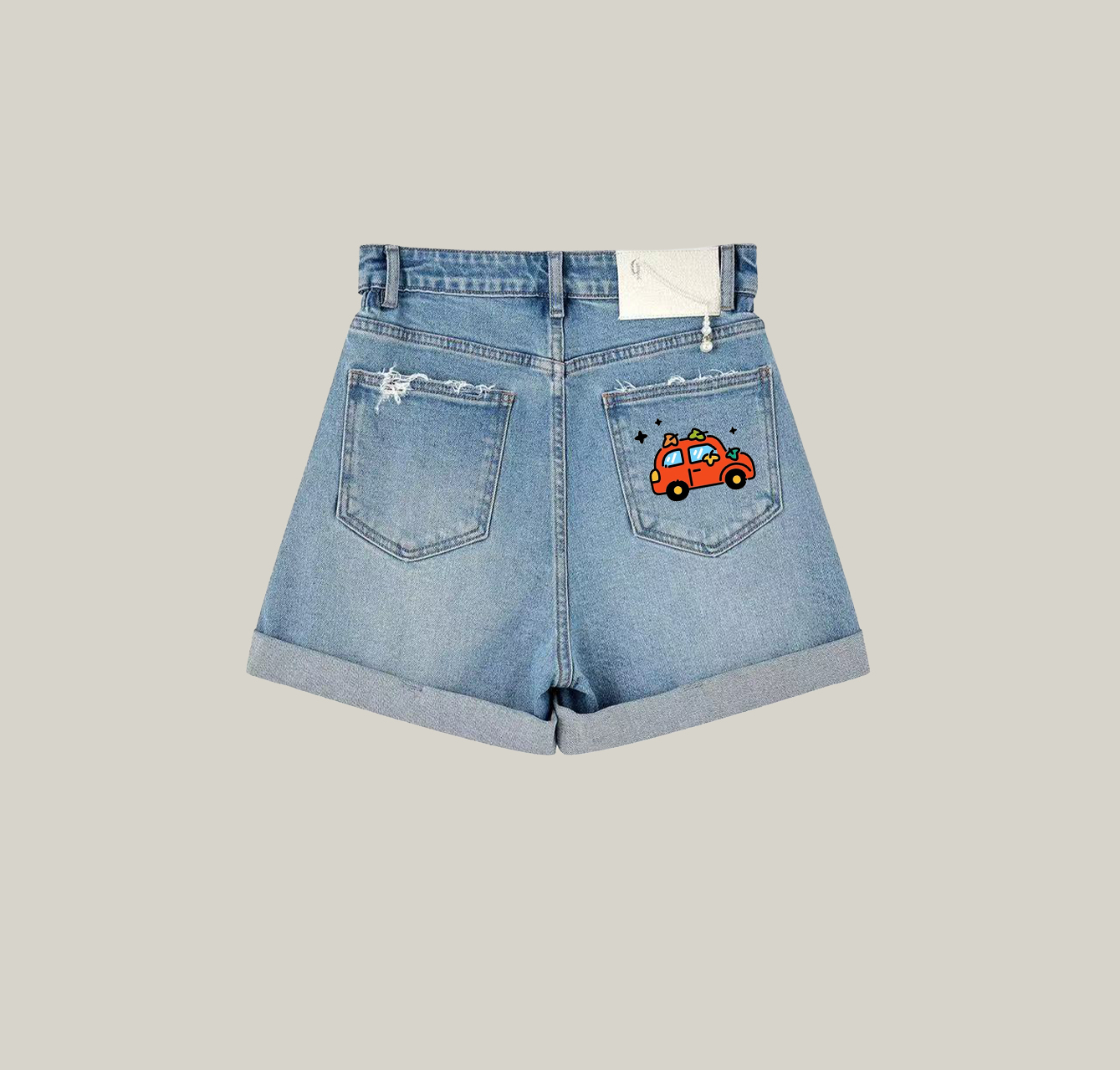 Denim shorts featuring a small car print—an essential item for your summer wardrobe.