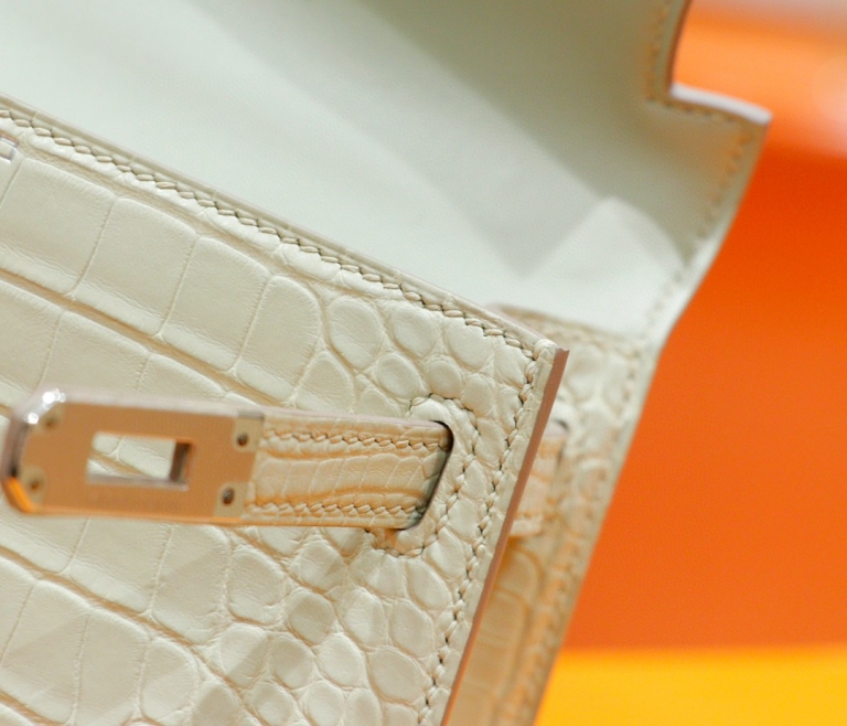 Hermes Minikelly 2nd generation, matte crocodile skin, cream white, silver buckle, 19cm