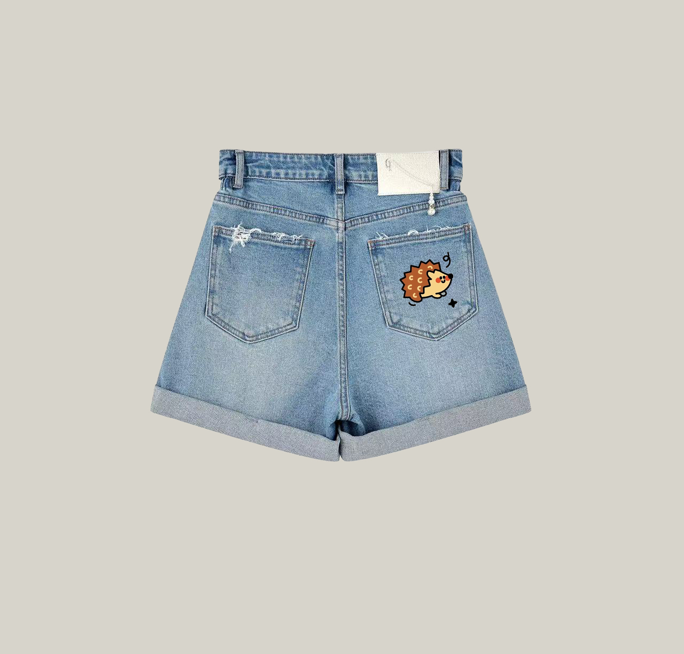 Denim shorts featuring a cute little hedgehog print—a must-have item for your summer wardrobe.