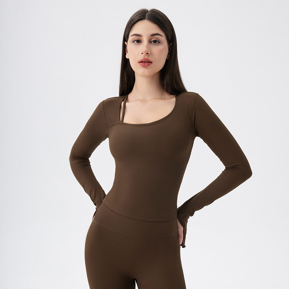 Women's long-sleeved yoga top with padded bra, nude ribbed design, slimming, quick-drying, suitable for running, sports, and fitness.