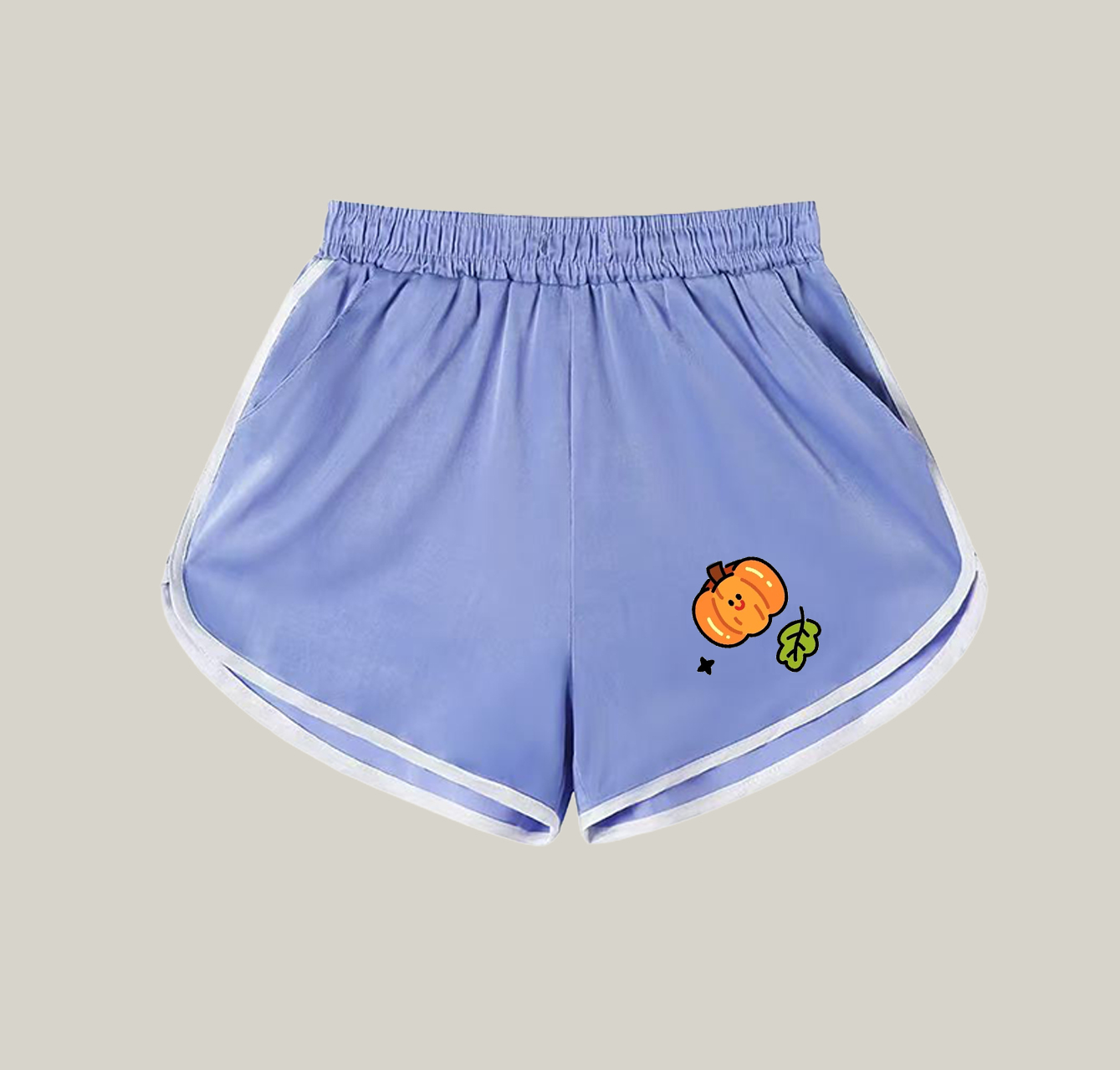 A pair of athletic shorts with a pumpkin pattern—a wardrobe essential.