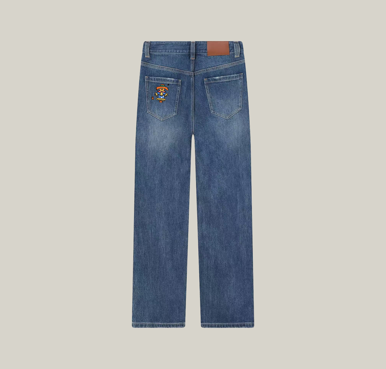 A pair of jeans with a scarecrow pattern—a wardrobe essential.