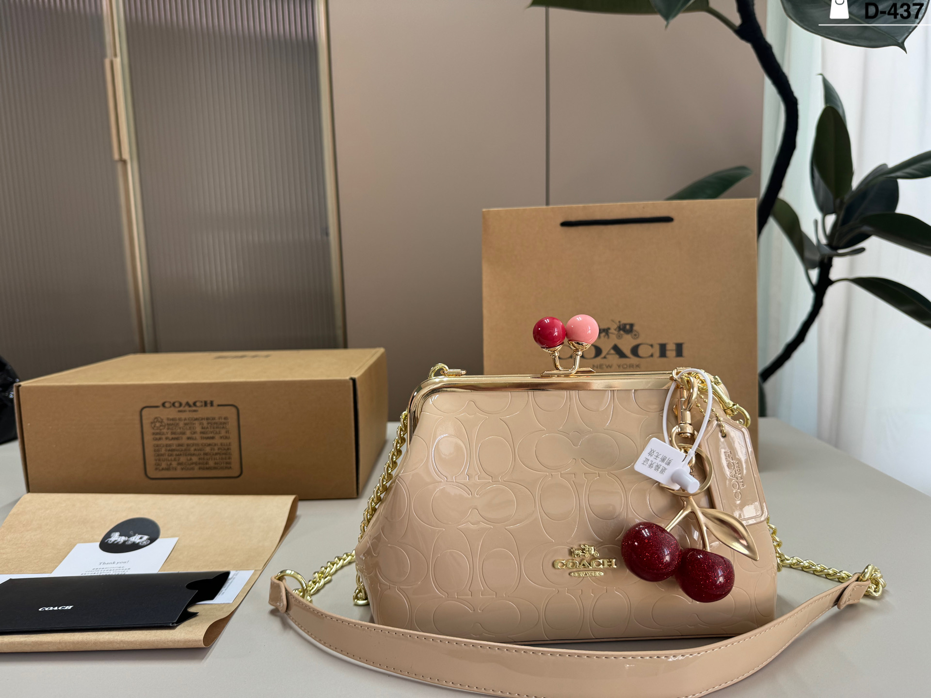 COACH Embossed Clip Bag
