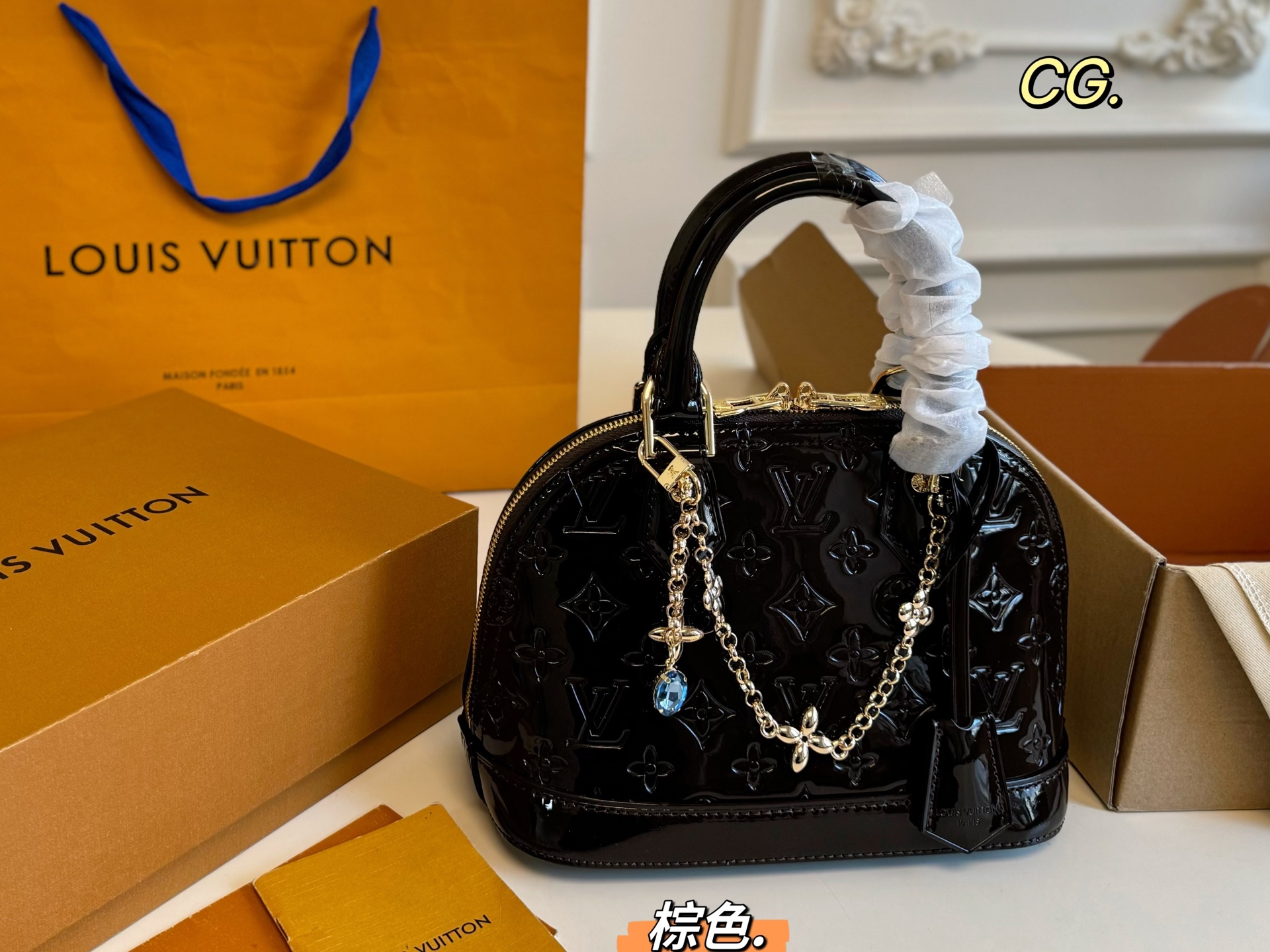 Louis Vuitton Alma patent leather shell bag