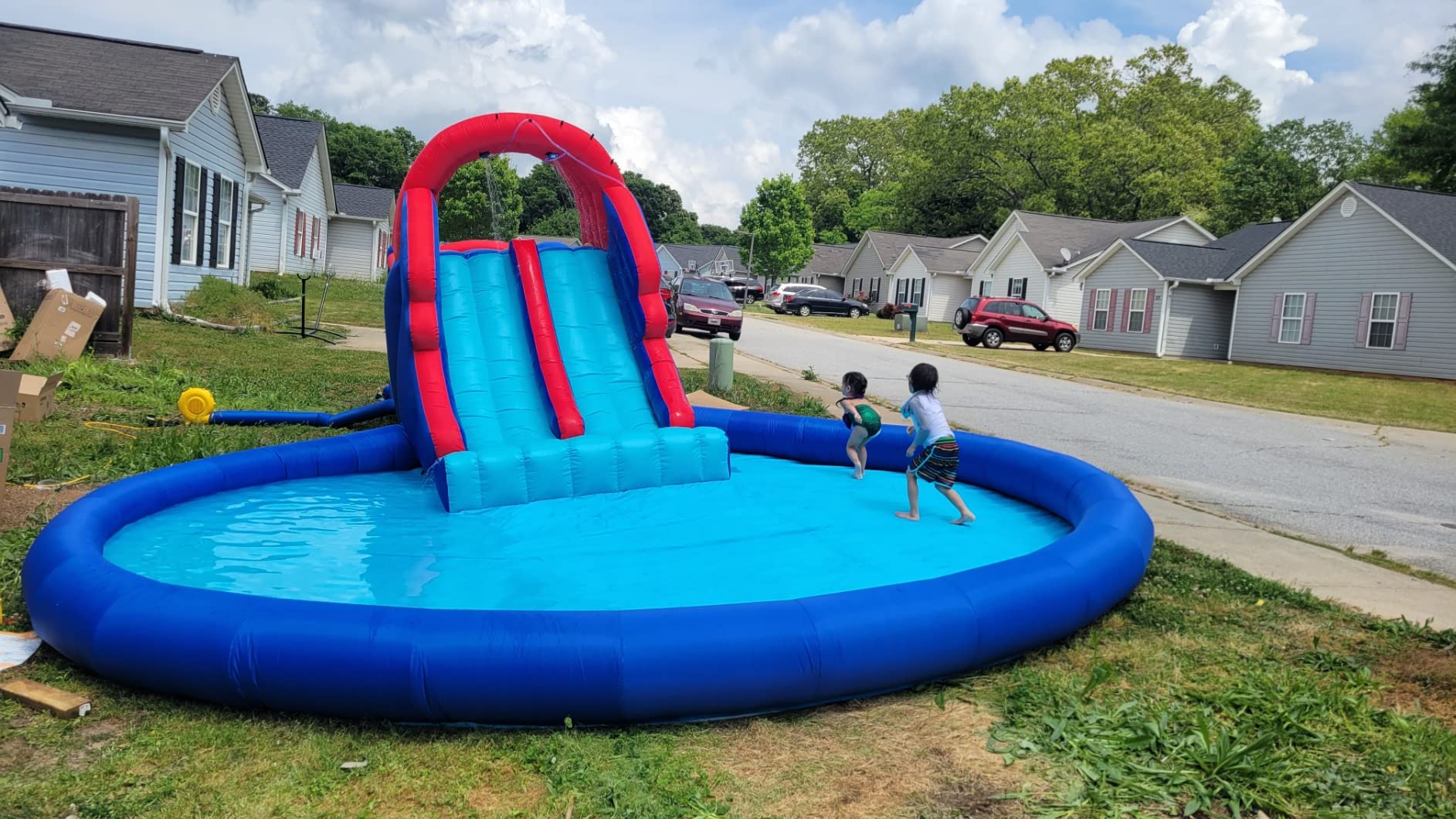 【Sports&Outdoors】Dual Slide Roundabout Inflatable Water Park - Climbing Wall, Slides, Bounce House & Huge Pool