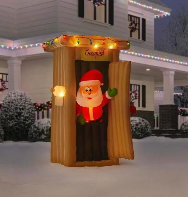 animated inflatable santa coming out of the house