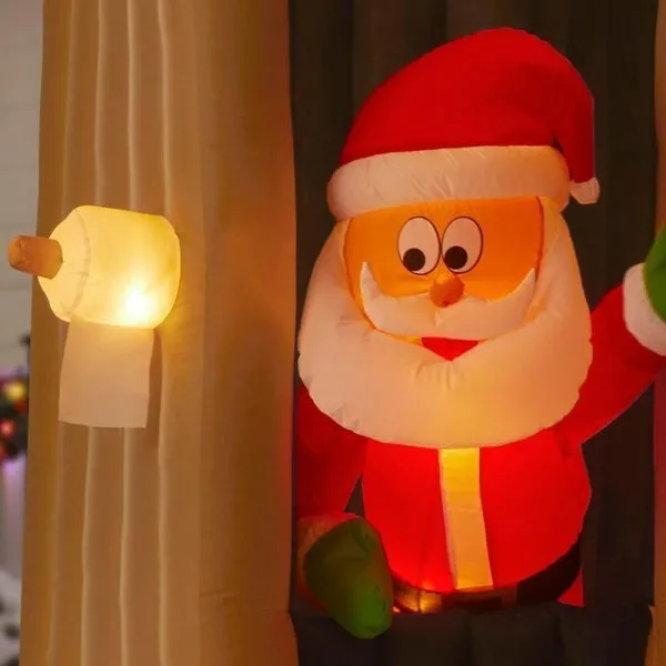 animated inflatable santa coming out of the house