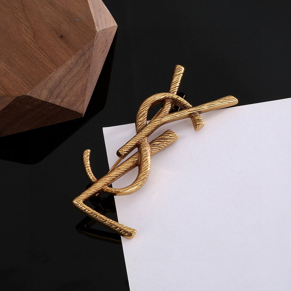 YSL brooch