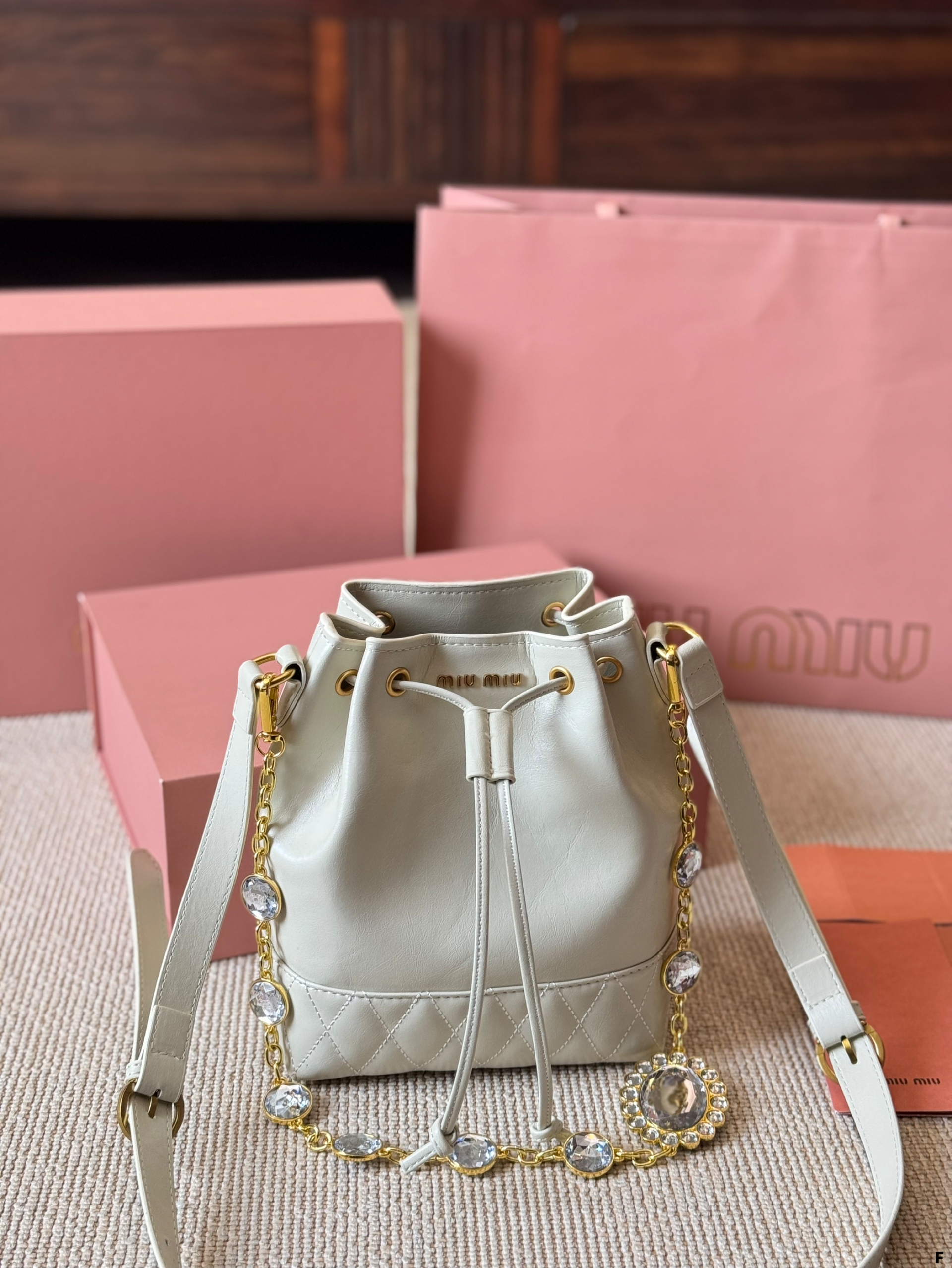 MIUMIU oil wax leather small bucket bag