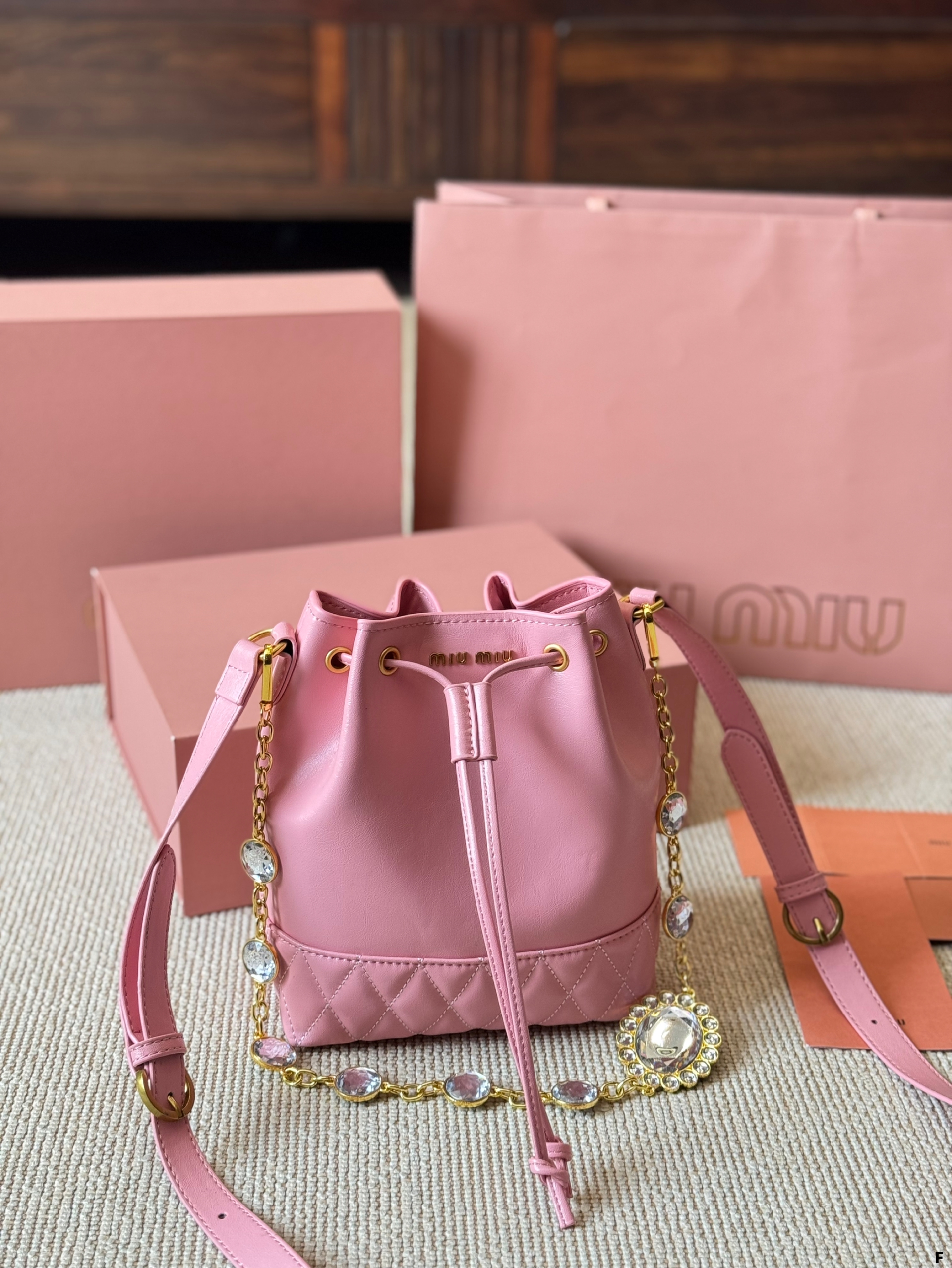 MIUMIU oil wax leather small bucket bag