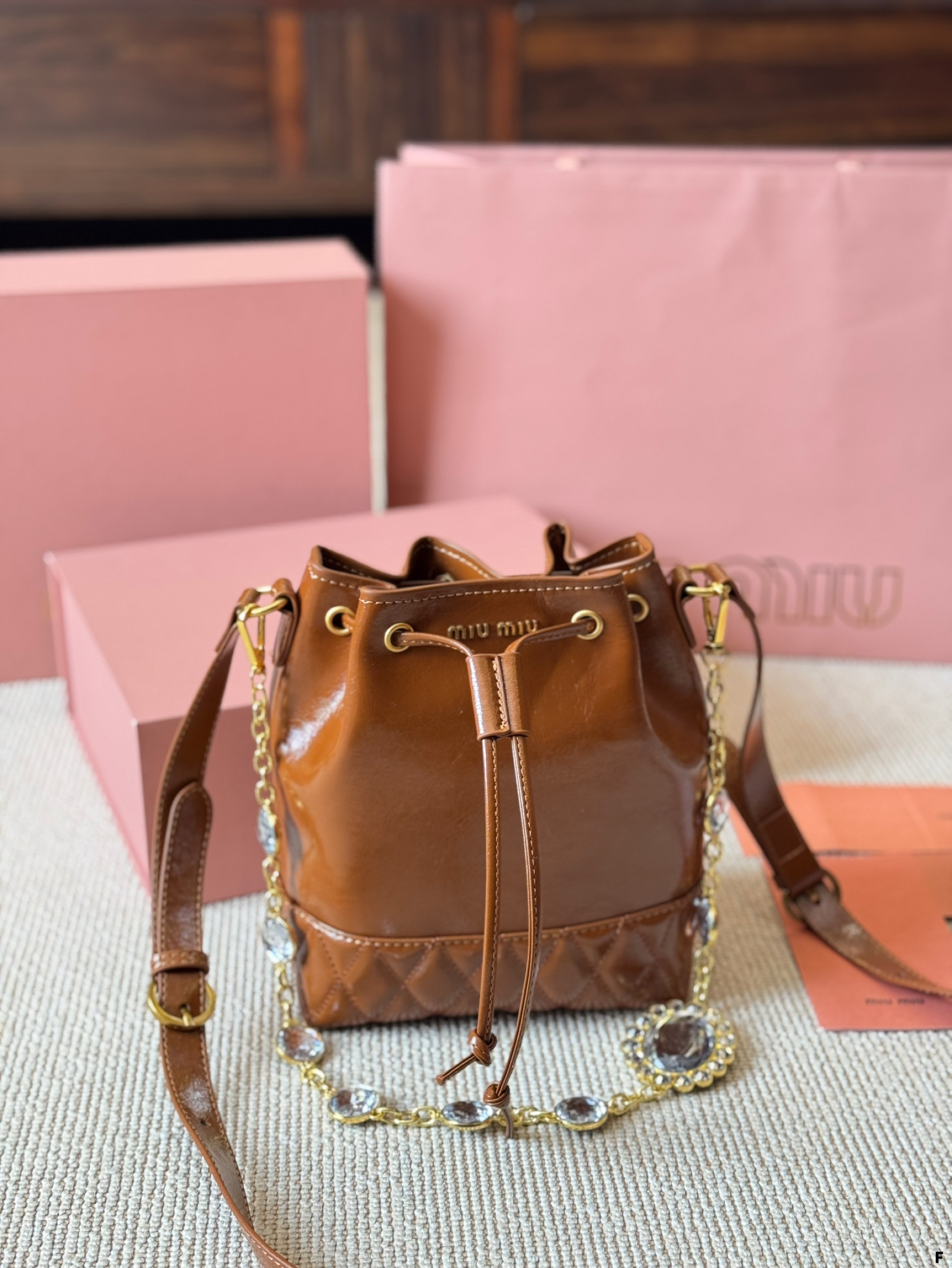 MIUMIU oil wax leather small bucket bag