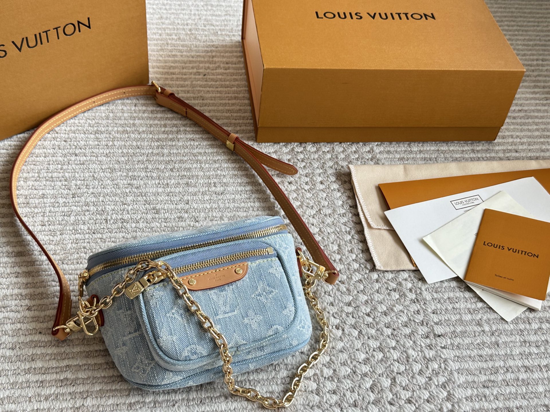 LV light-colored denim mini waist bag