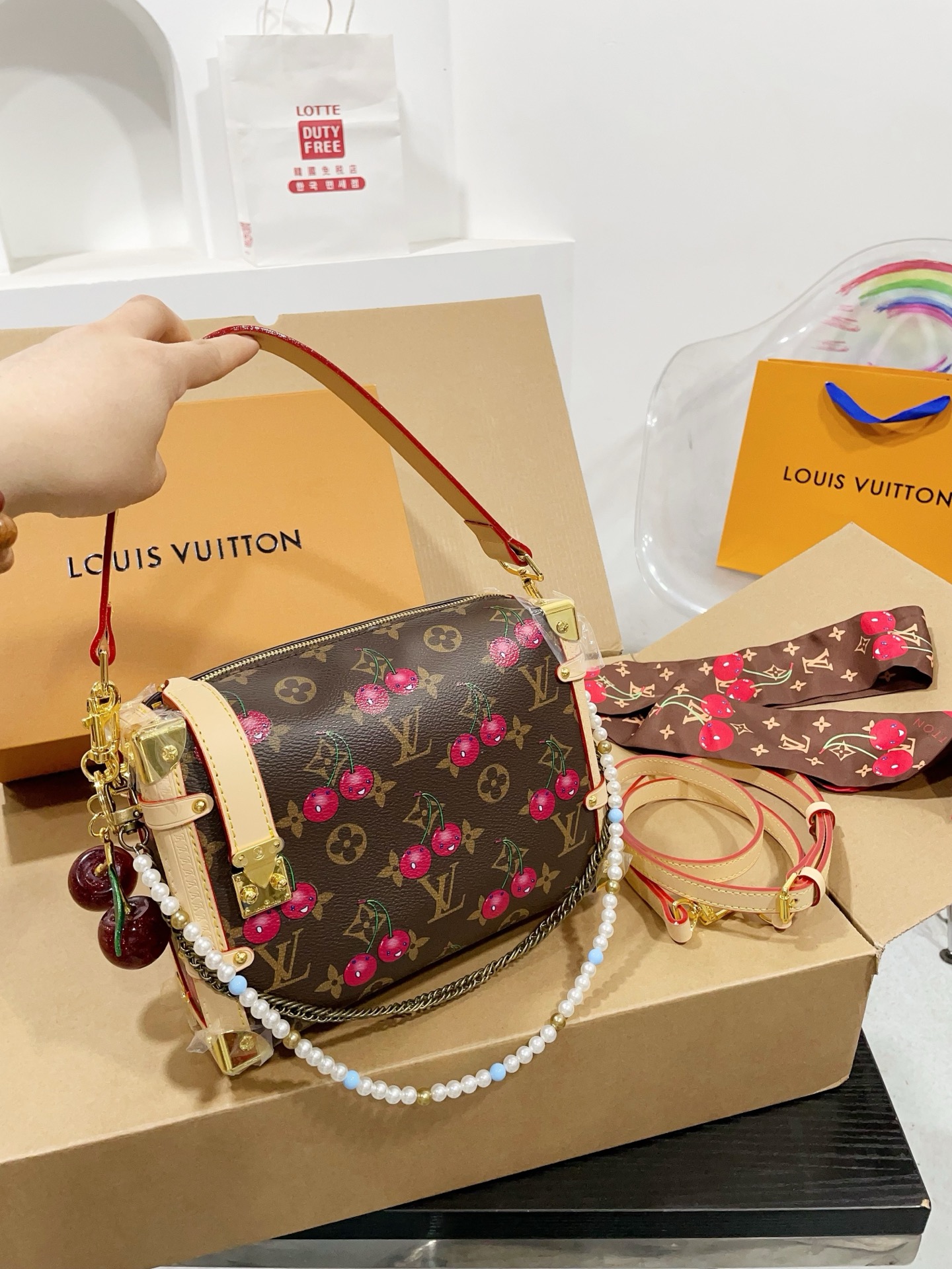 LV Side trunk cherry bag