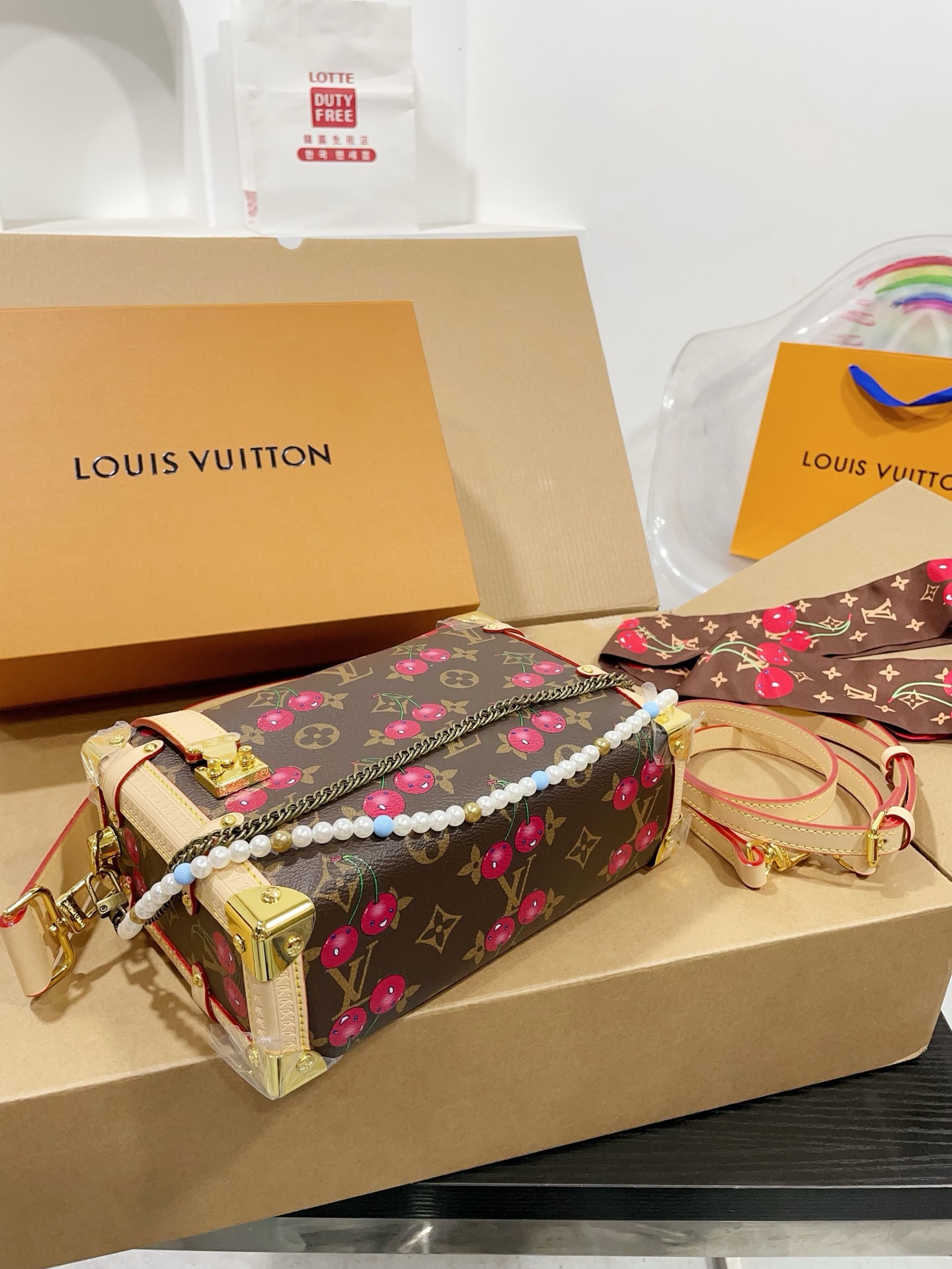 LV Side trunk cherry bag
