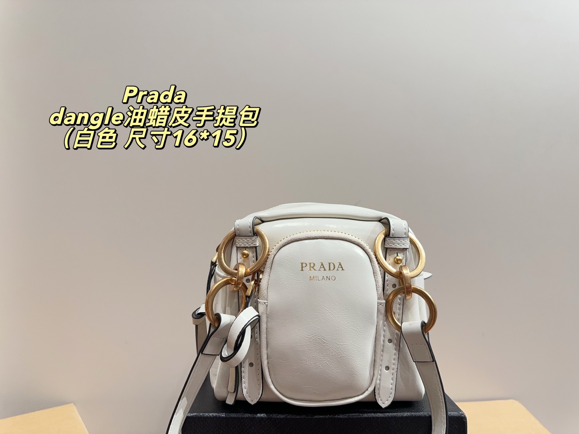 Prada dangle mini oil-wax leather handbag