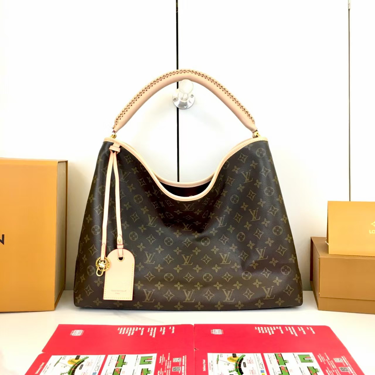 LV again artsy monogram handbag