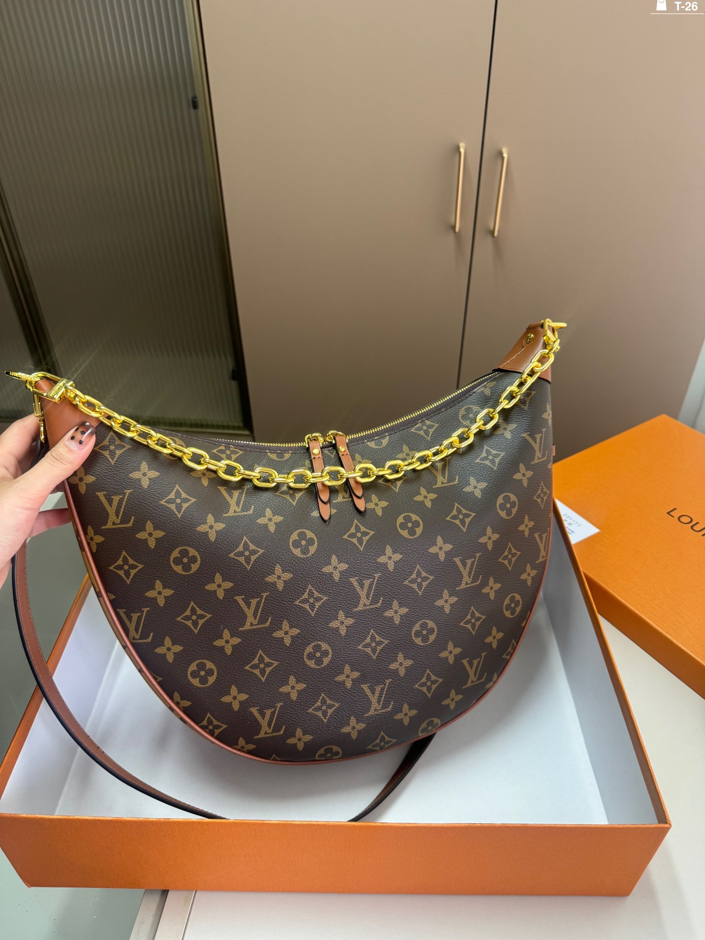 LV crescent-shaped bag chain strap shoulder bag