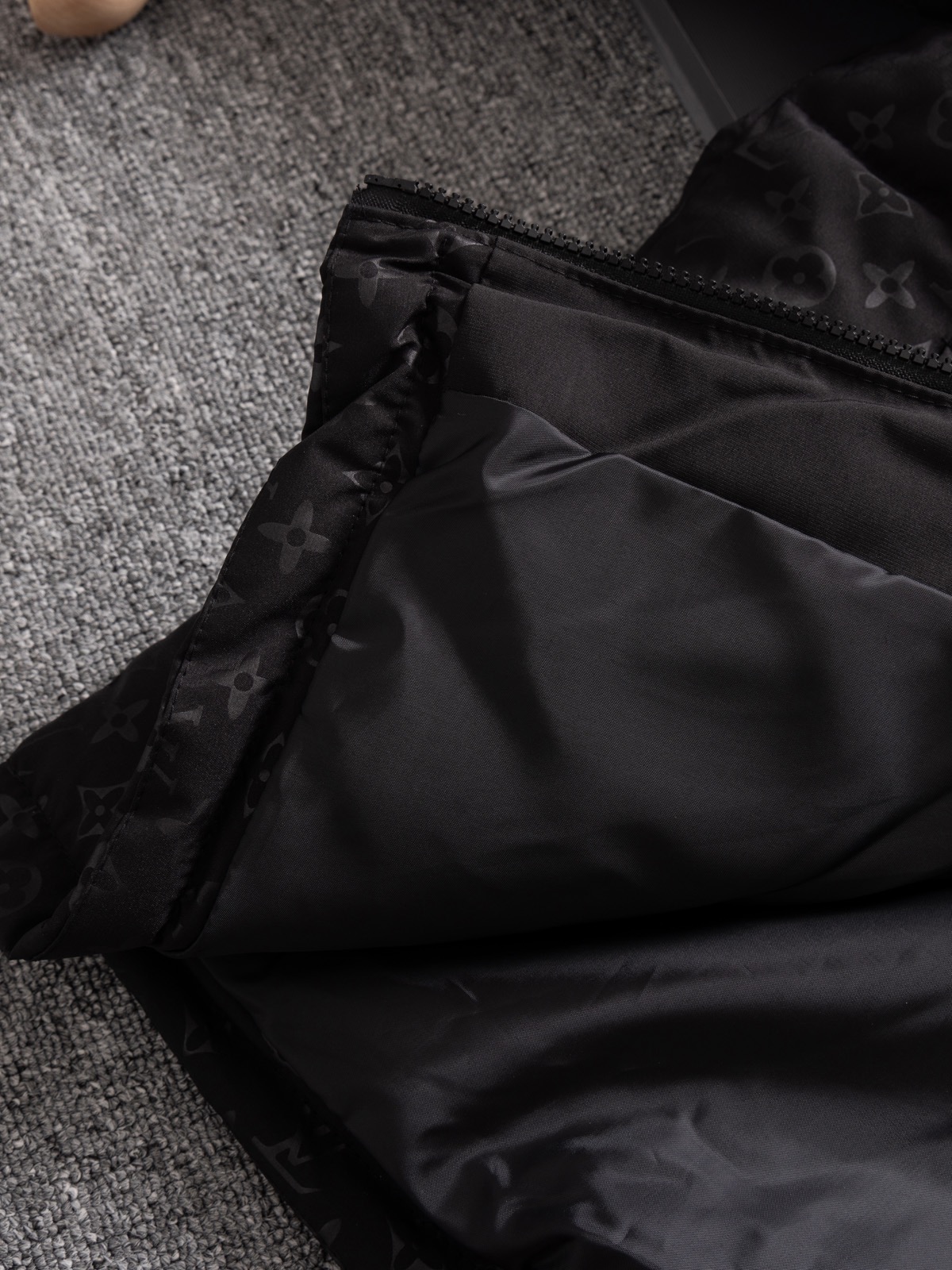The North Face collaboration with Louis Vuitton (LV) in a cotton jacket.