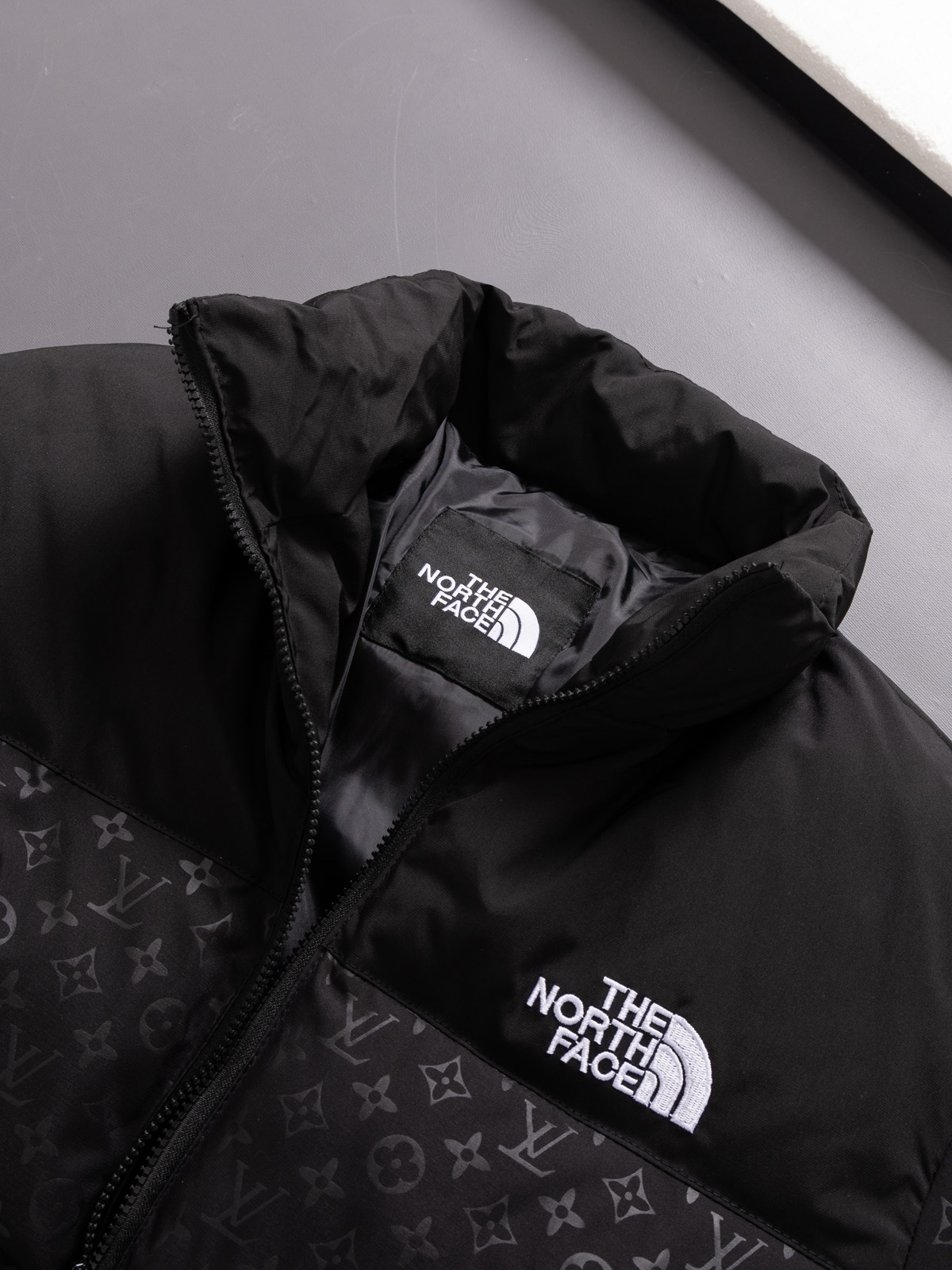The North Face collaboration with Louis Vuitton (LV) in a cotton jacket.