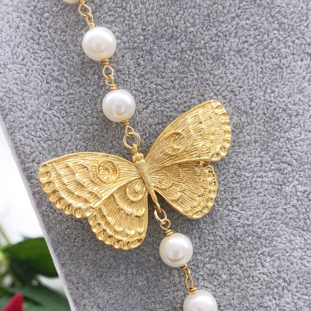 Chanel butterfly sweater chain
