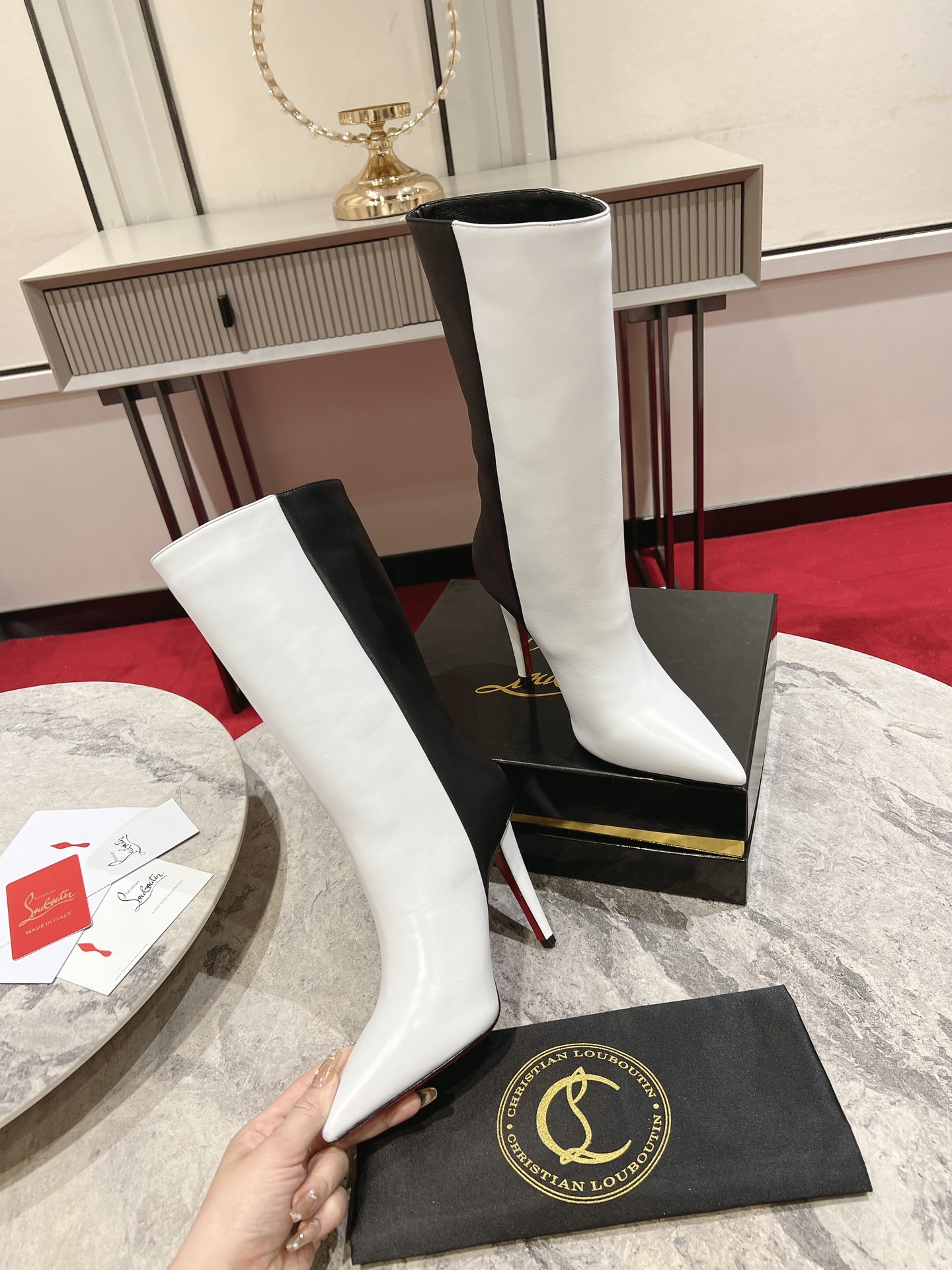 Christian Louboutin red-soled long bootsThe Astrilarge Booty mid-calf boots