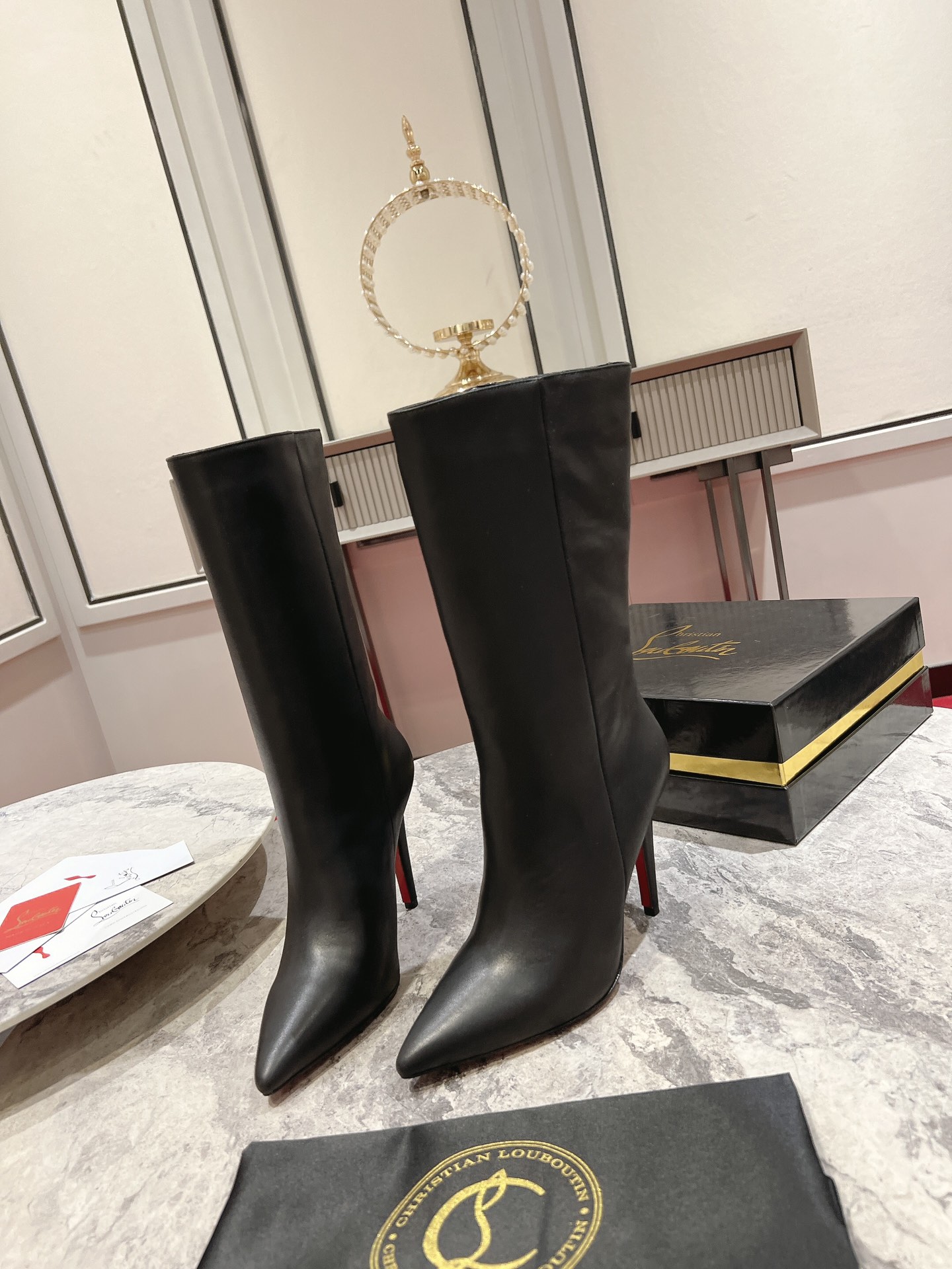 Christian Louboutin red-soled long bootsThe Astrilarge Booty mid-calf boots