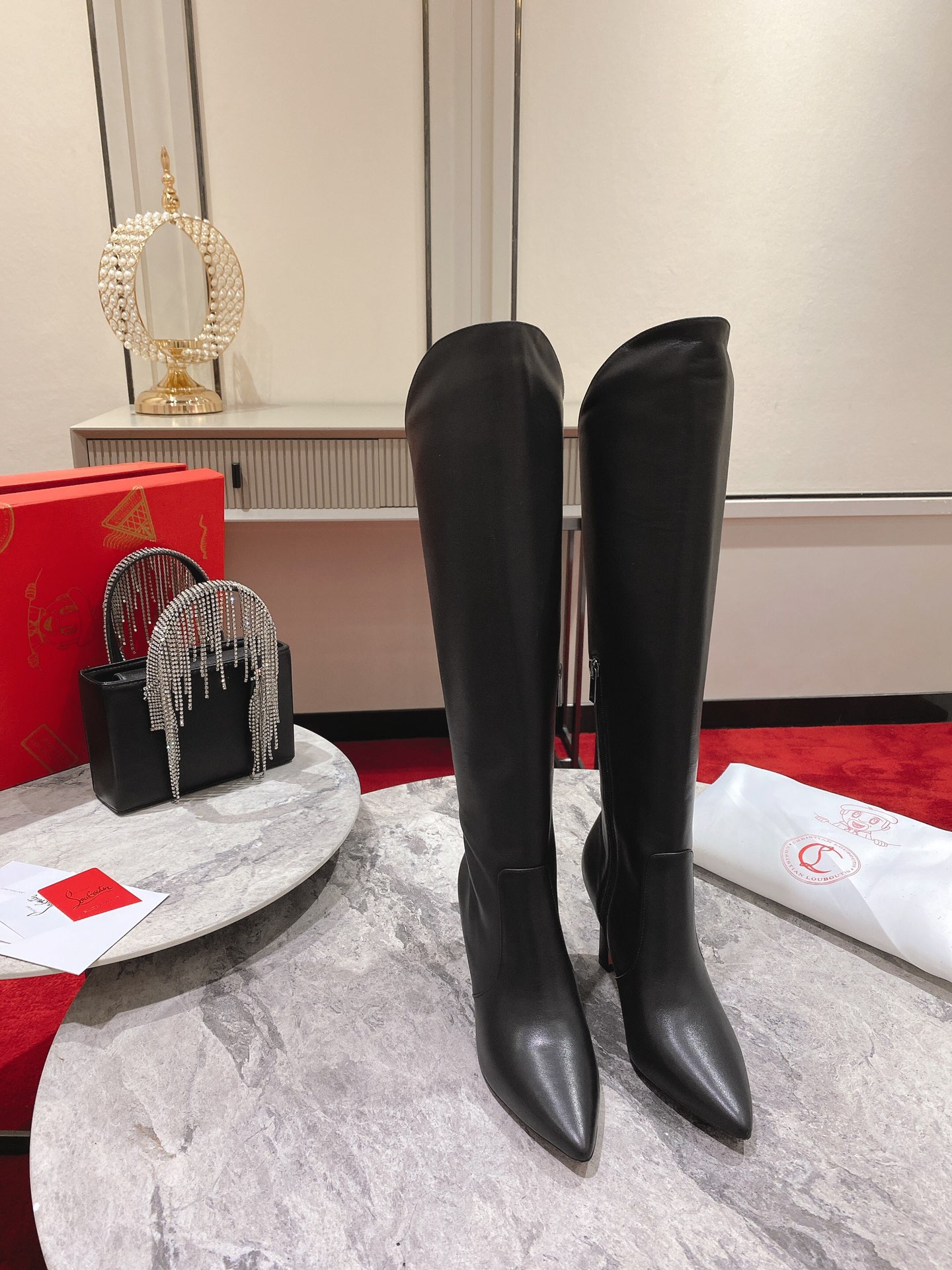 Christian Louboutin red-soled shoes The classic long boots