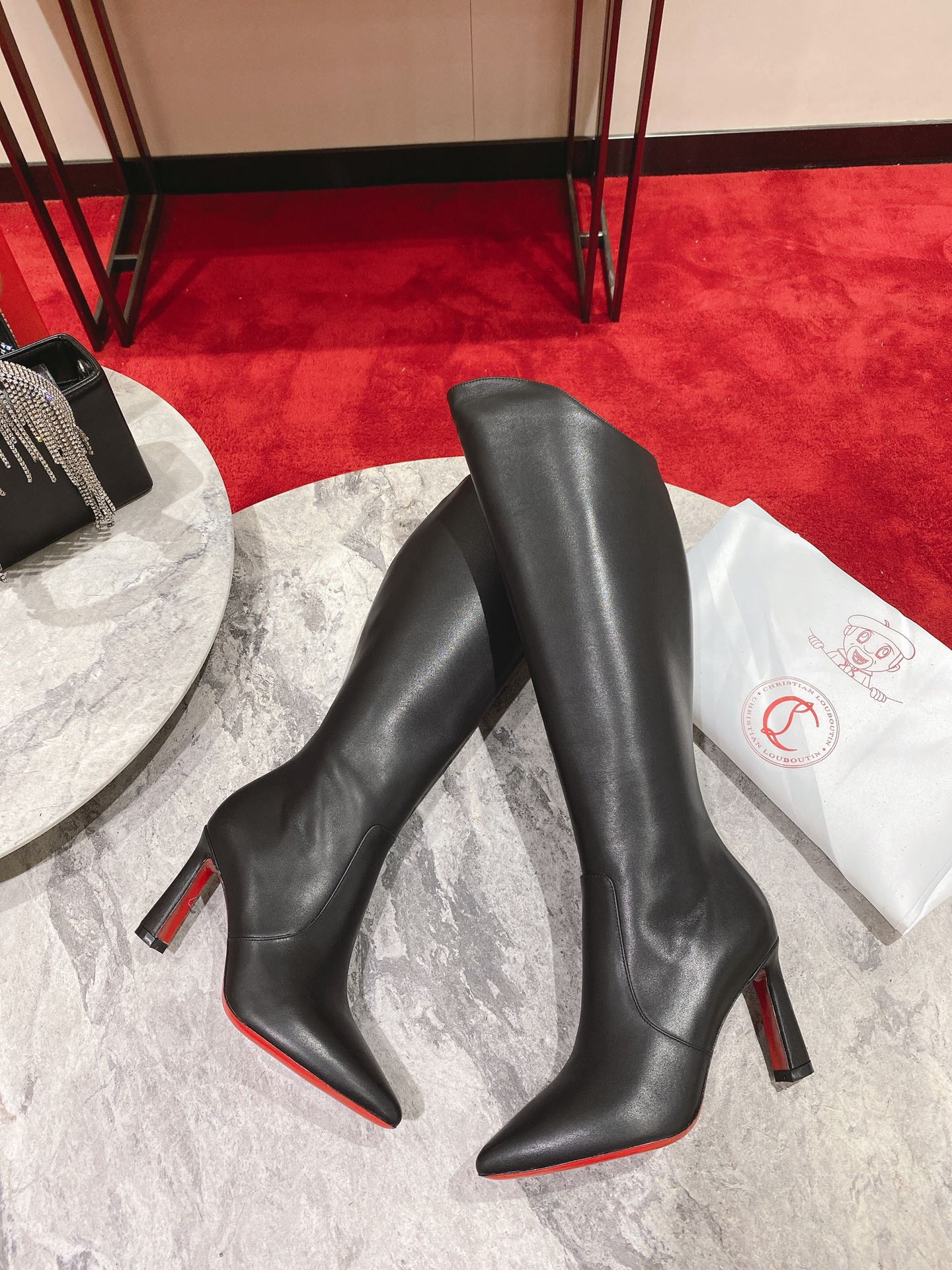 Christian Louboutin red-soled shoes The classic long boots