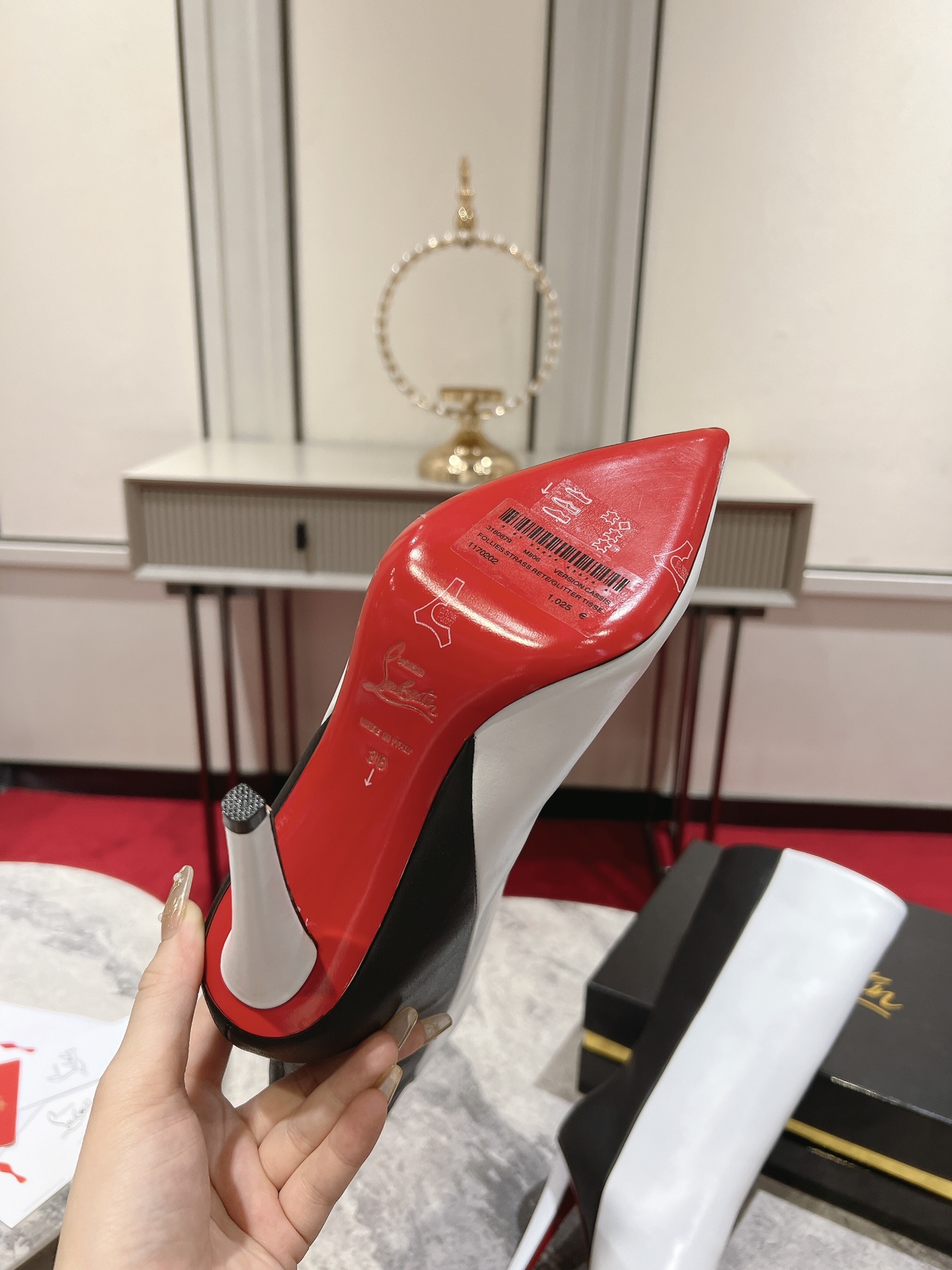 Christian Louboutin red-soled long bootsThe Astrilarge Booty mid-calf boots