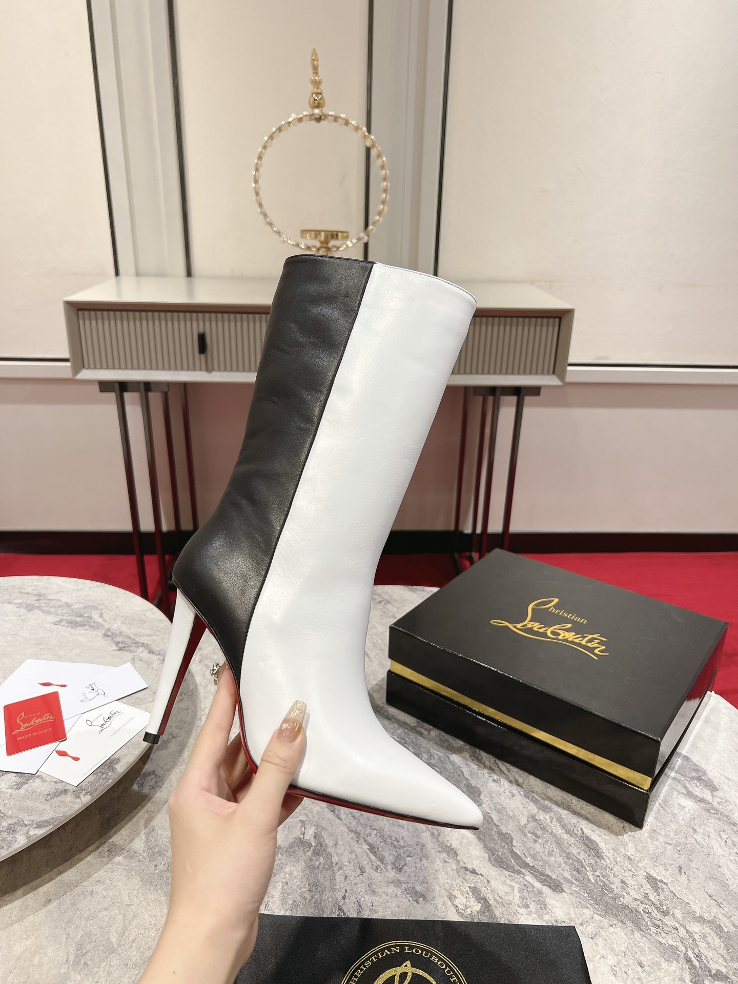 Christian Louboutin red-soled long bootsThe Astrilarge Booty mid-calf boots