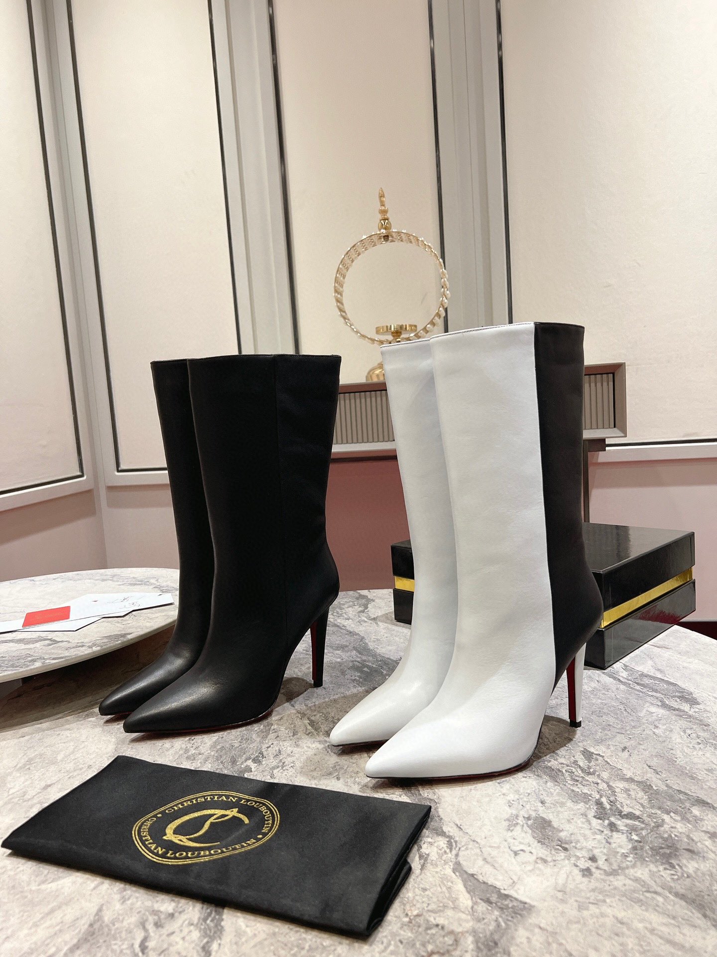 Christian Louboutin red-soled long bootsThe Astrilarge Booty mid-calf boots