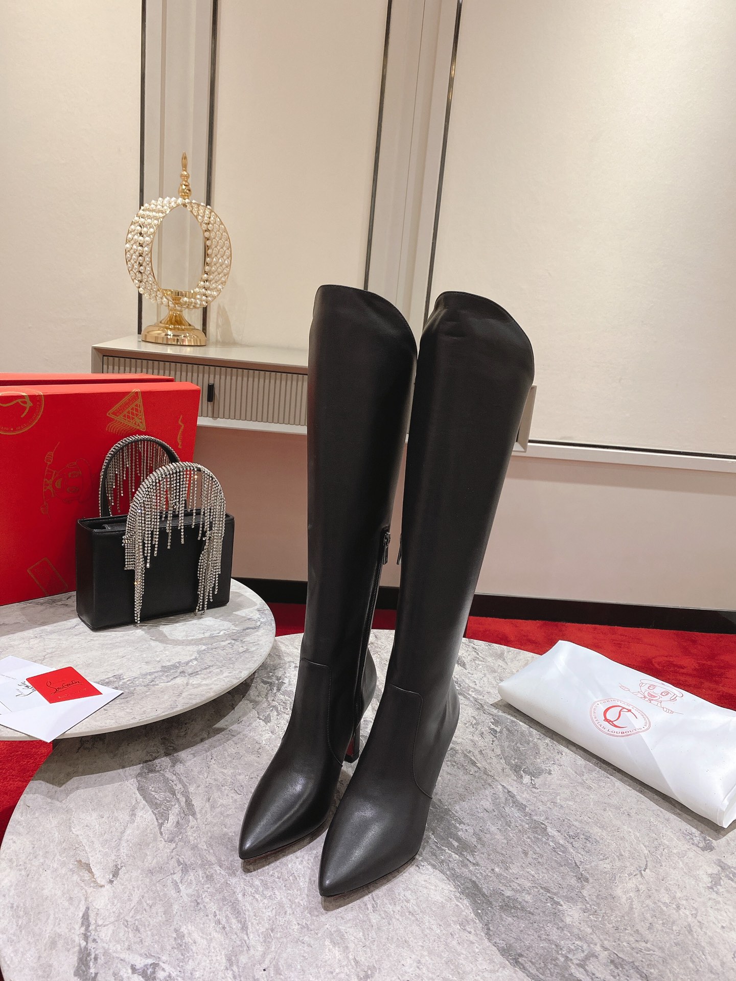 Christian Louboutin red-soled shoes The classic long boots