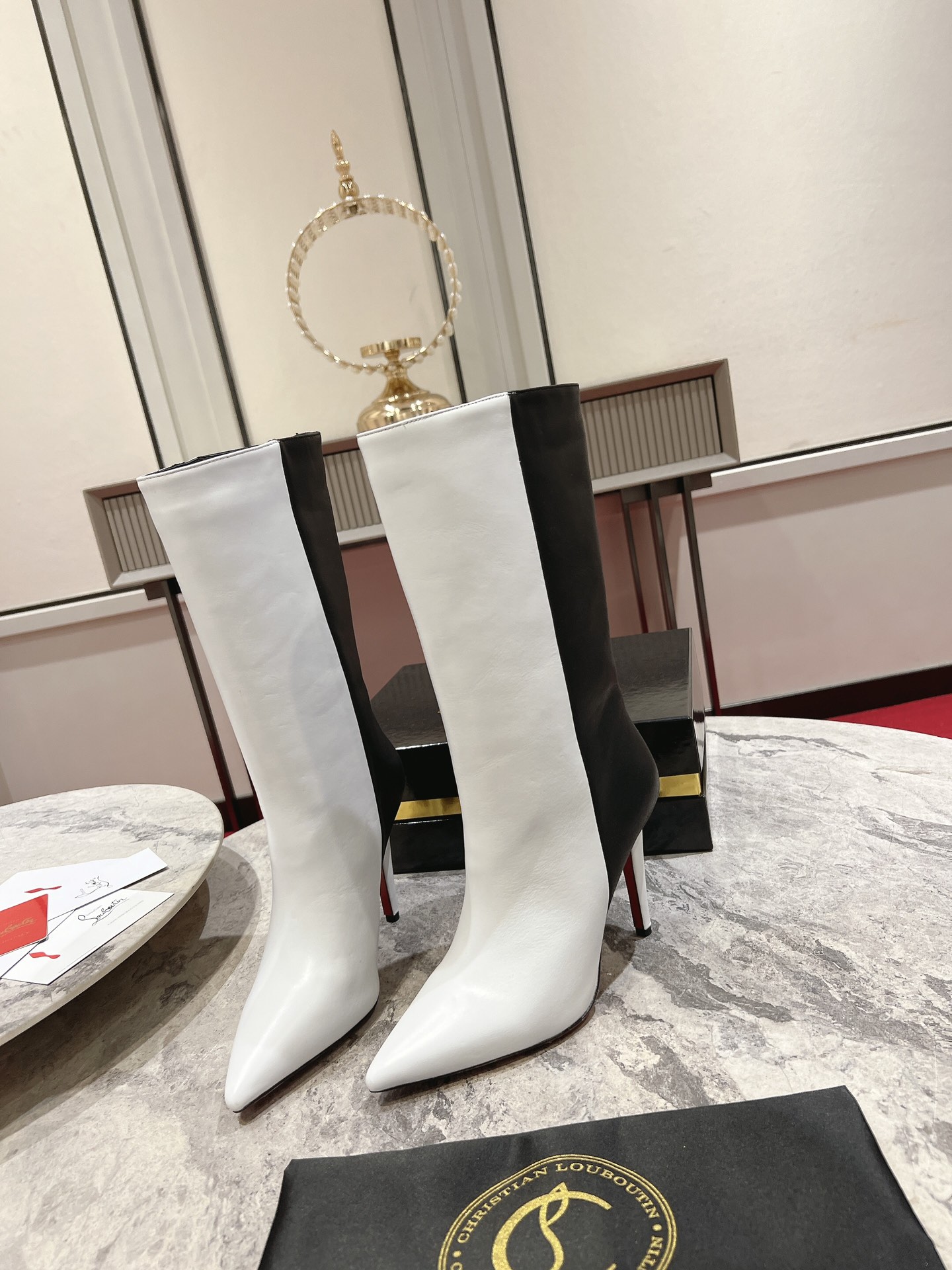 Christian Louboutin red-soled long bootsThe Astrilarge Booty mid-calf boots