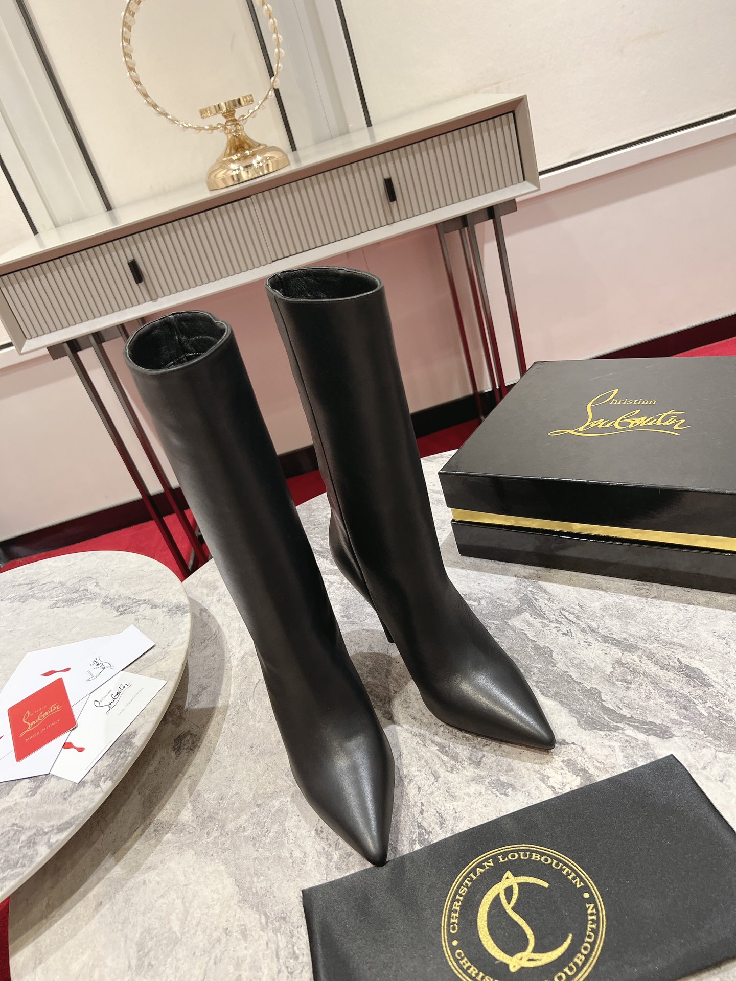 Christian Louboutin red-soled long bootsThe Astrilarge Booty mid-calf boots