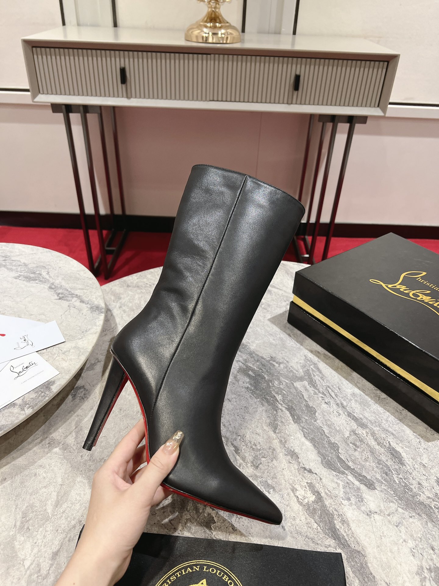Christian Louboutin red-soled long bootsThe Astrilarge Booty mid-calf boots