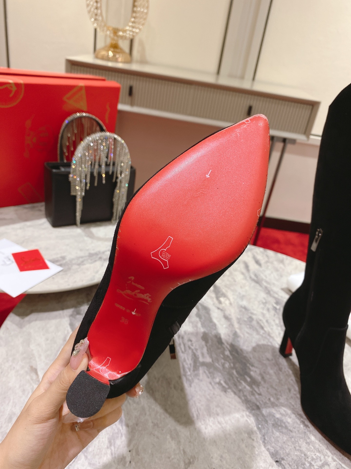 Christian Louboutin red-soled shoes The classic long boots