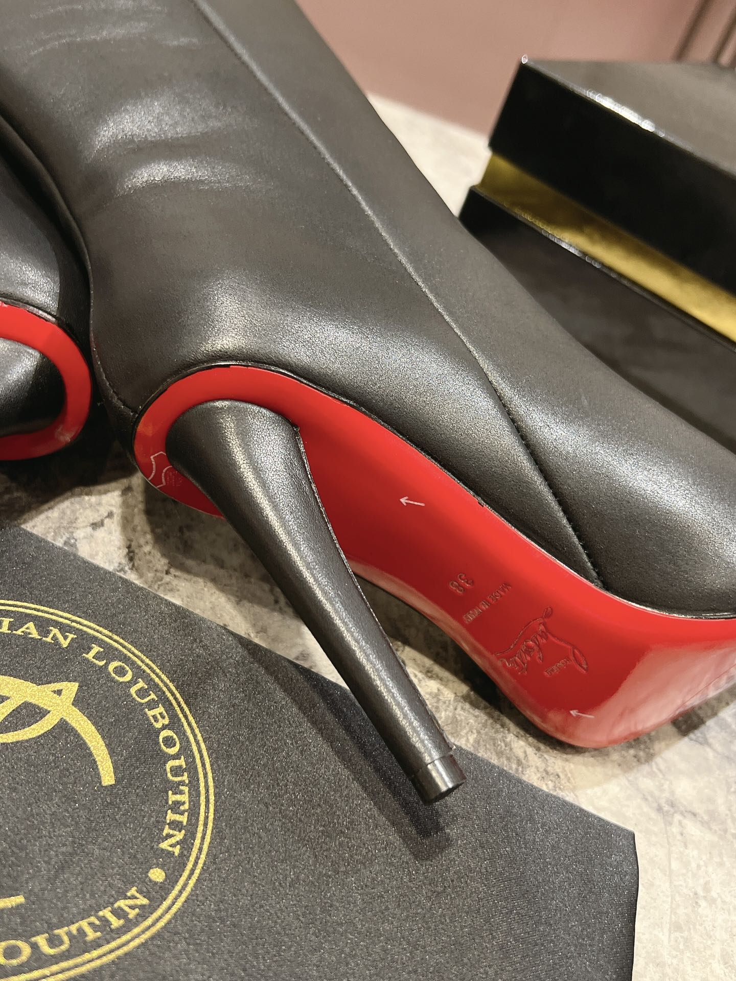 Christian Louboutin red-soled long bootsThe Astrilarge Booty mid-calf boots