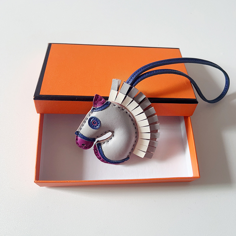 Handsewn unicorn pendant