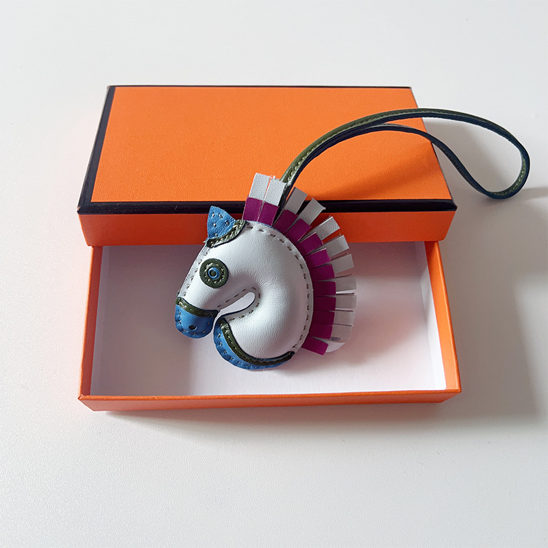 Handsewn unicorn pendant