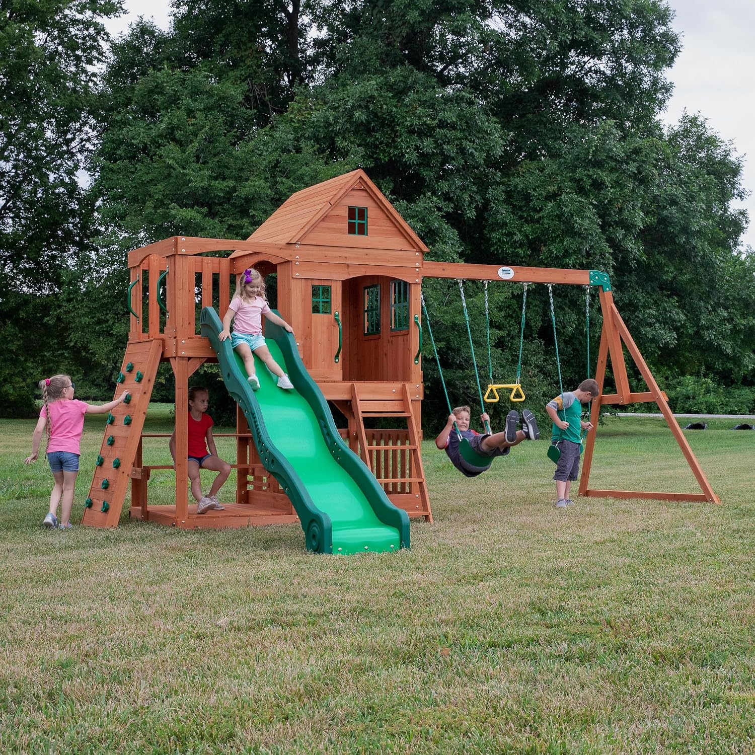 Backyard Discovery Hillcrest Cedar Wooden Swing Set, Upper Fort, Lower Playhouse, Slide, Swings, Acrobat Bar, Rock Wall