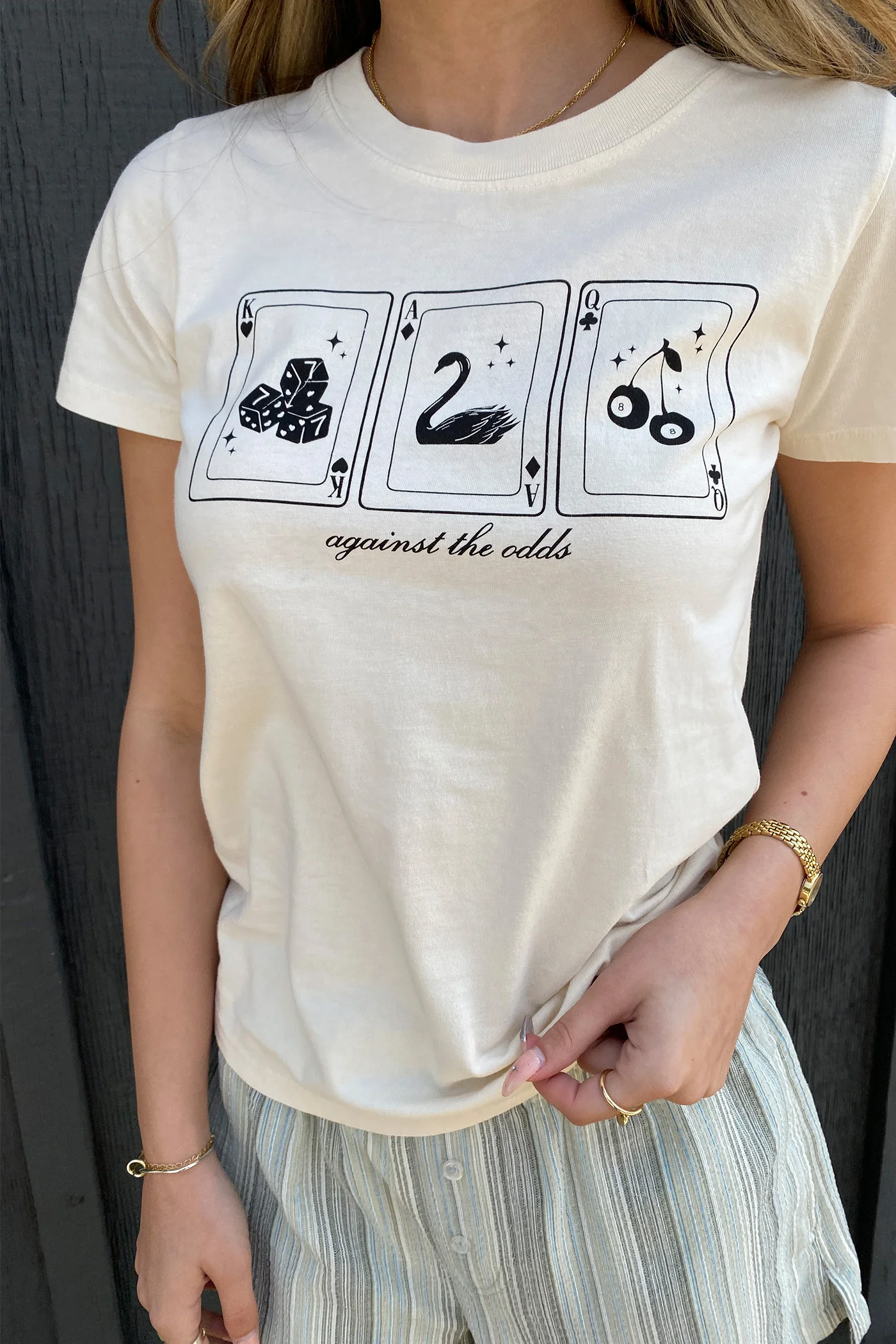 Against The Odds Long Loose Graphic Baby Tee