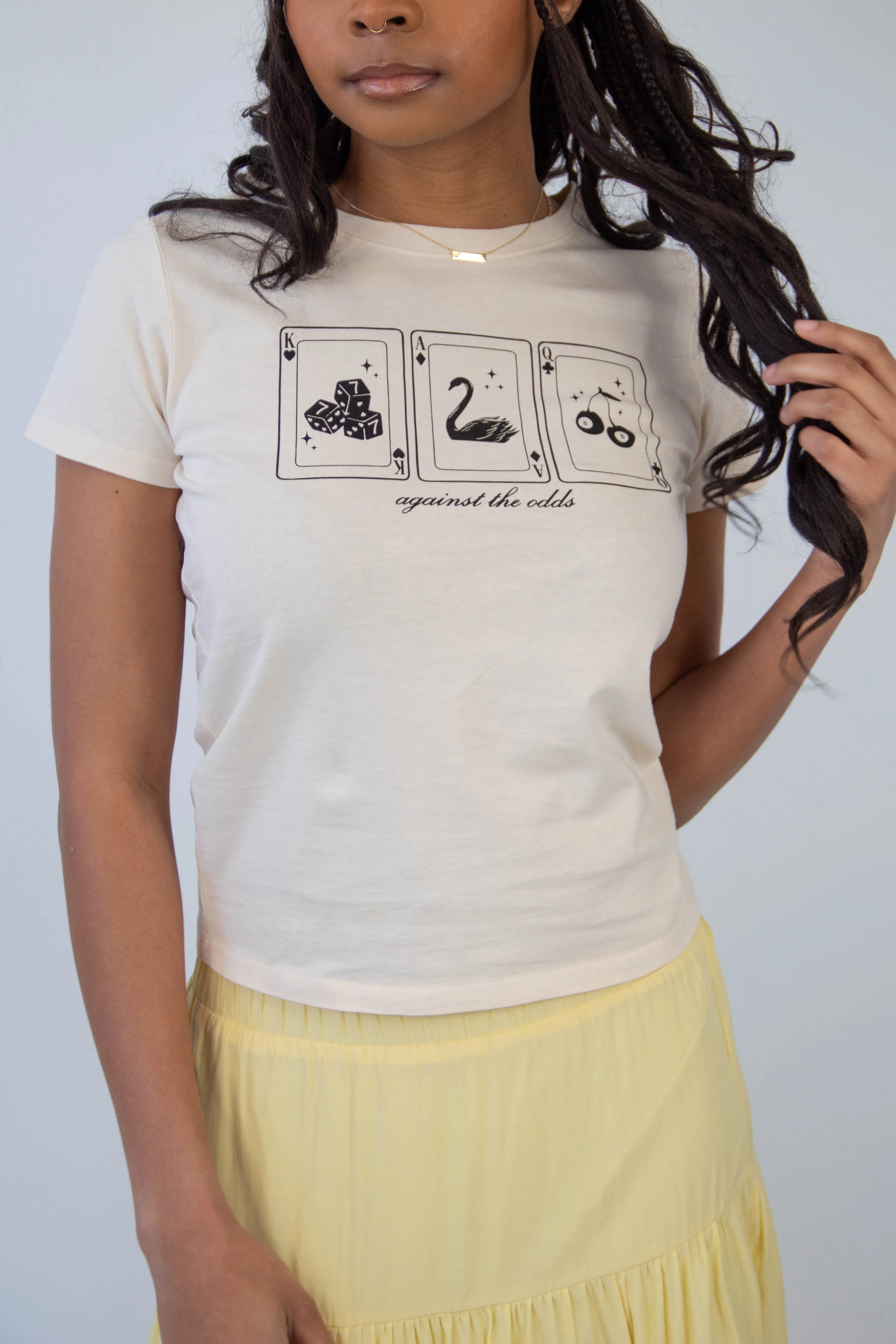 Against The Odds Long Loose Graphic Baby Tee