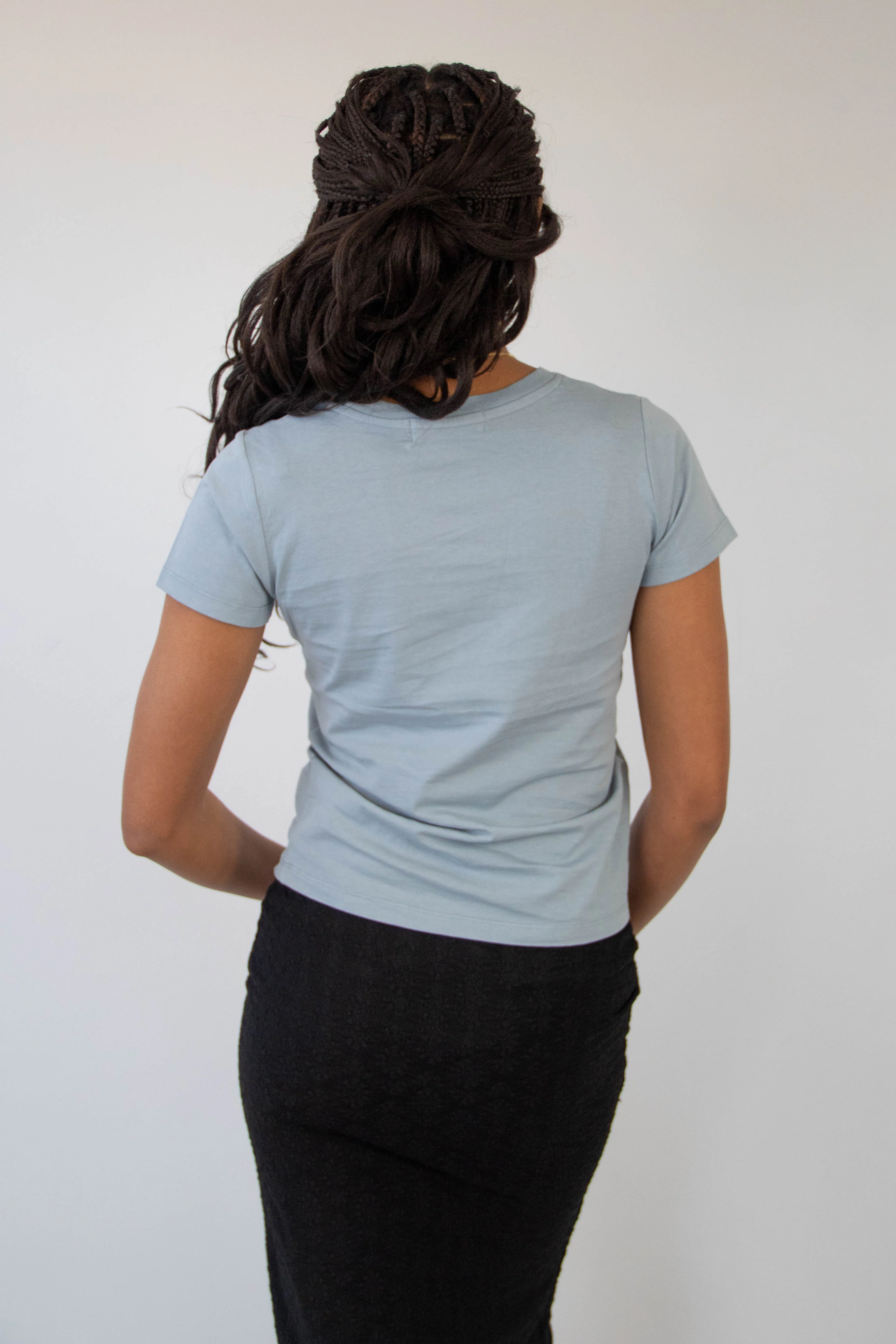 Against The Odds Long Loose Graphic Baby Tee