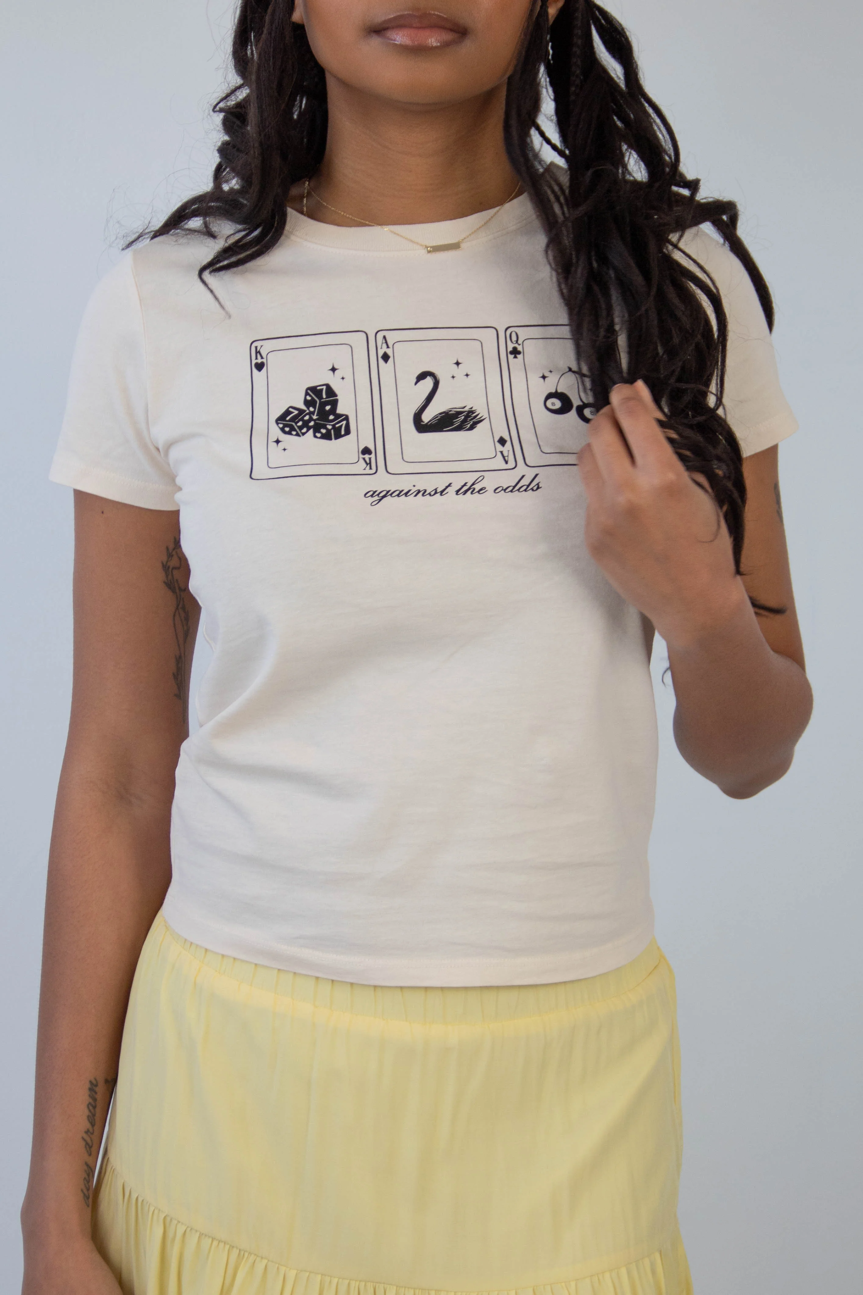 Against The Odds Long Loose Graphic Baby Tee