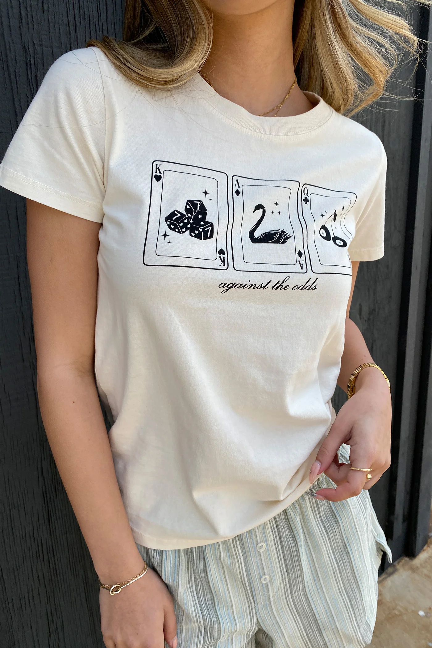 Against The Odds Long Loose Graphic Baby Tee