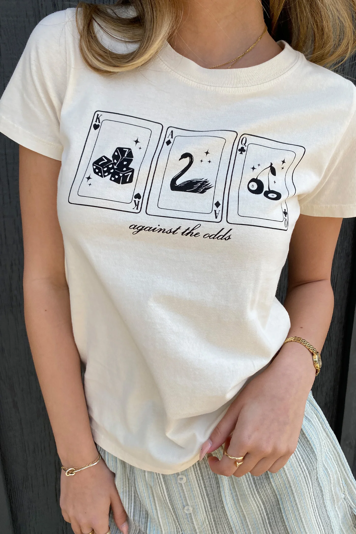 Against The Odds Long Loose Graphic Baby Tee