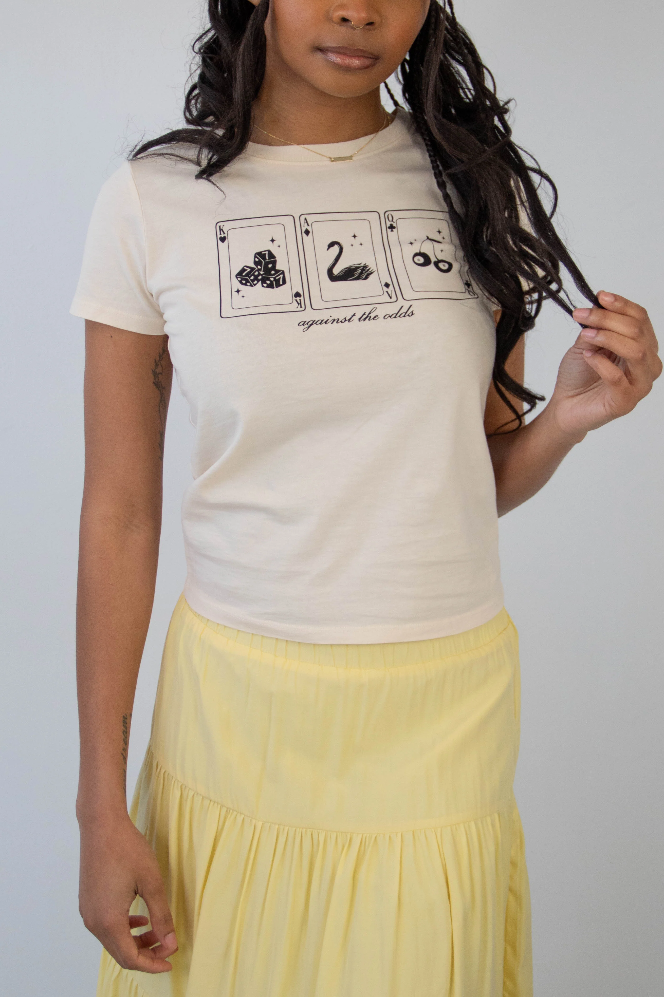 Against The Odds Long Loose Graphic Baby Tee